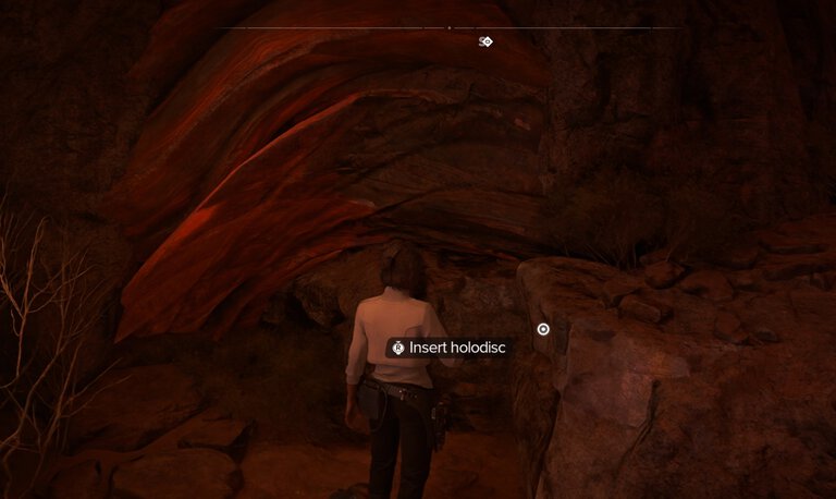 Insert the Holodisc into the slot in the cave