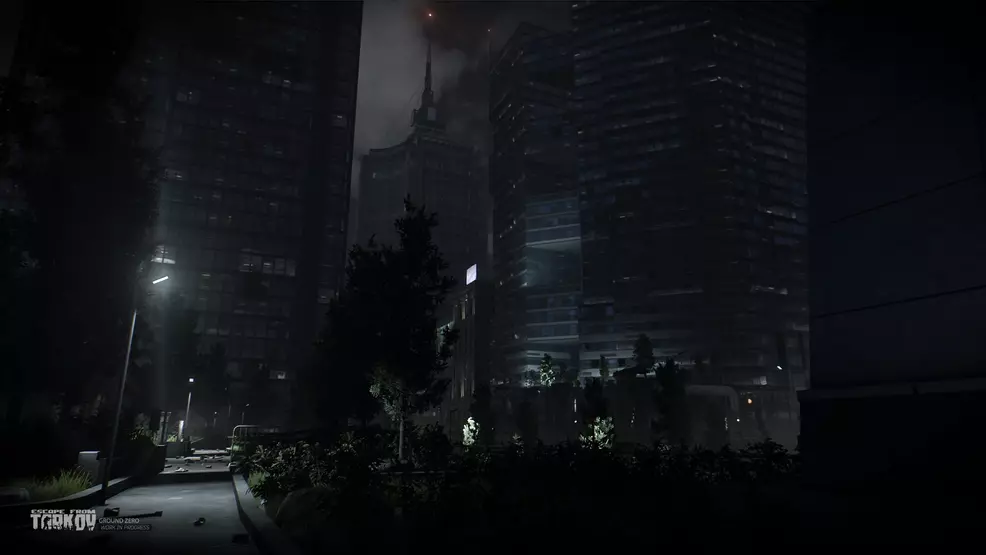 Escape from Tarkov: A ruined city at night, some lights are still burning in the office buildings.