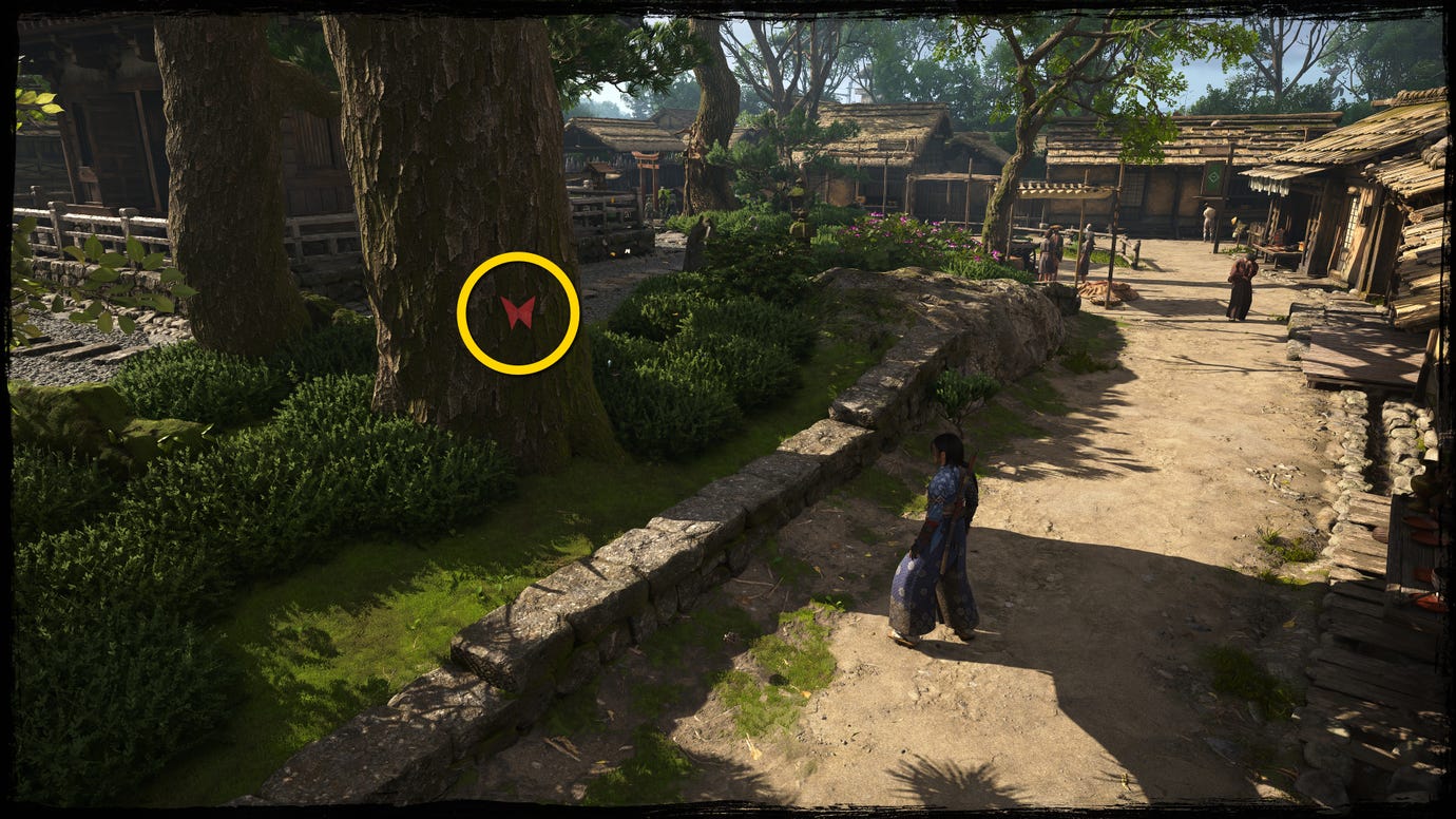 A close-up of a tree in Osaka in Assassin's Creed Shadows, with a yellow circle highlighting the location of a red Origami Butterfly.