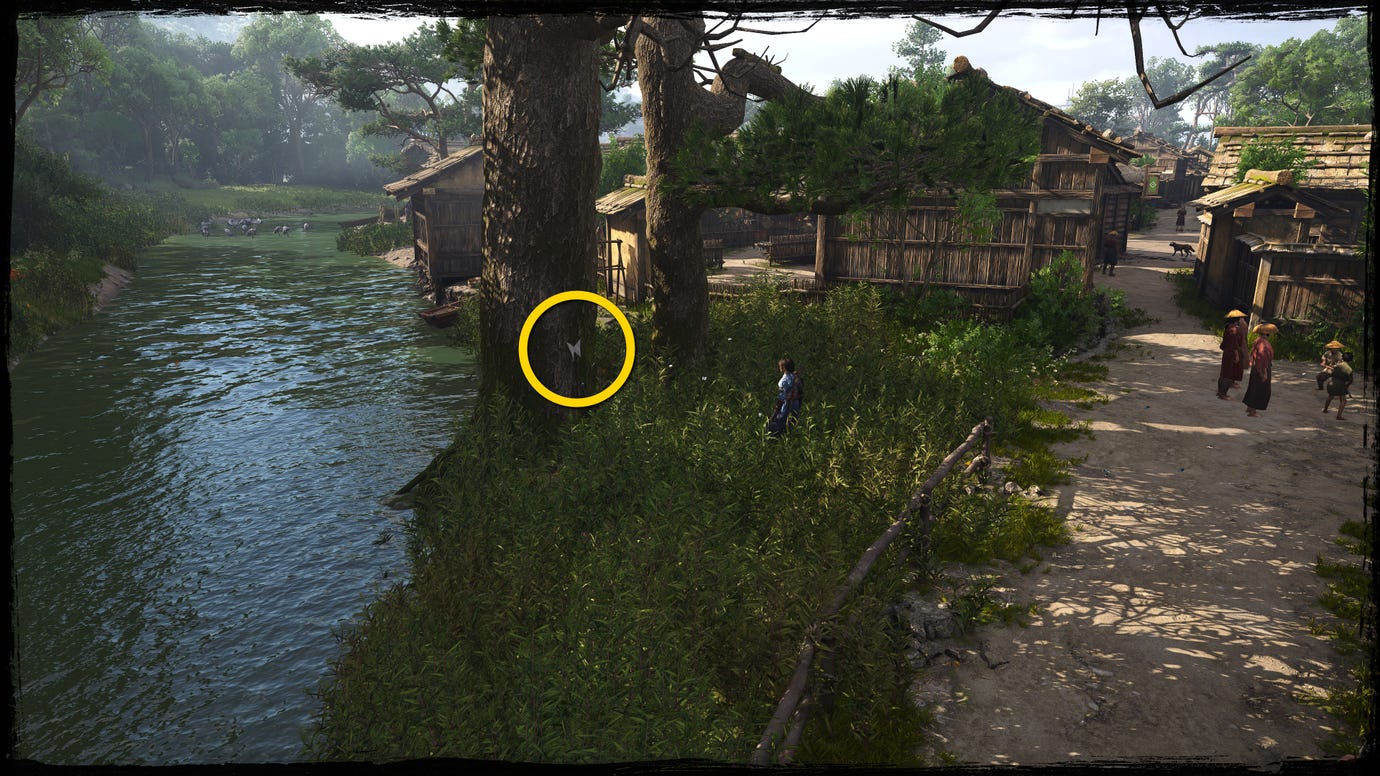 A shot of a tree next to a river in Osaka in Assassin's Creed Shadows, with a yellow circle highlighting the location of a white Origami Butterfly.