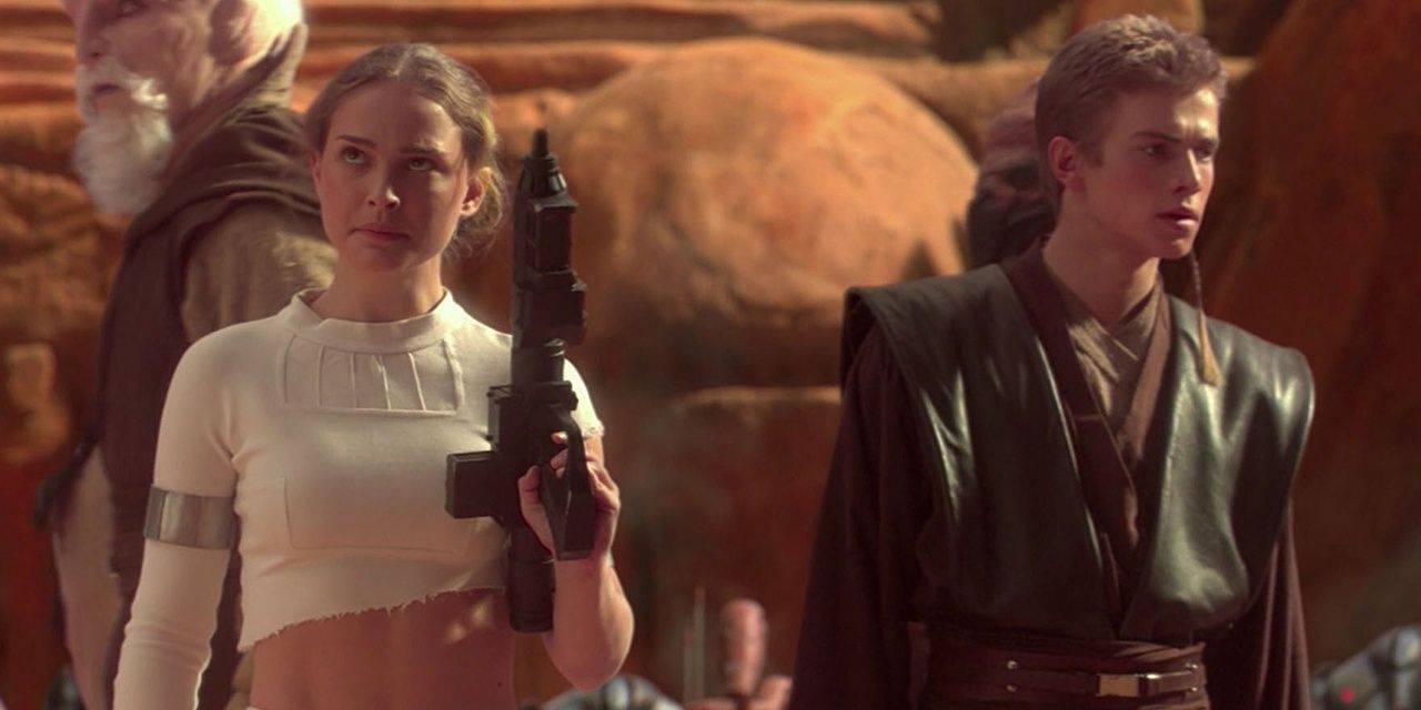 Anakin Skywalker and Padme standing on the Geonosian battlefield.