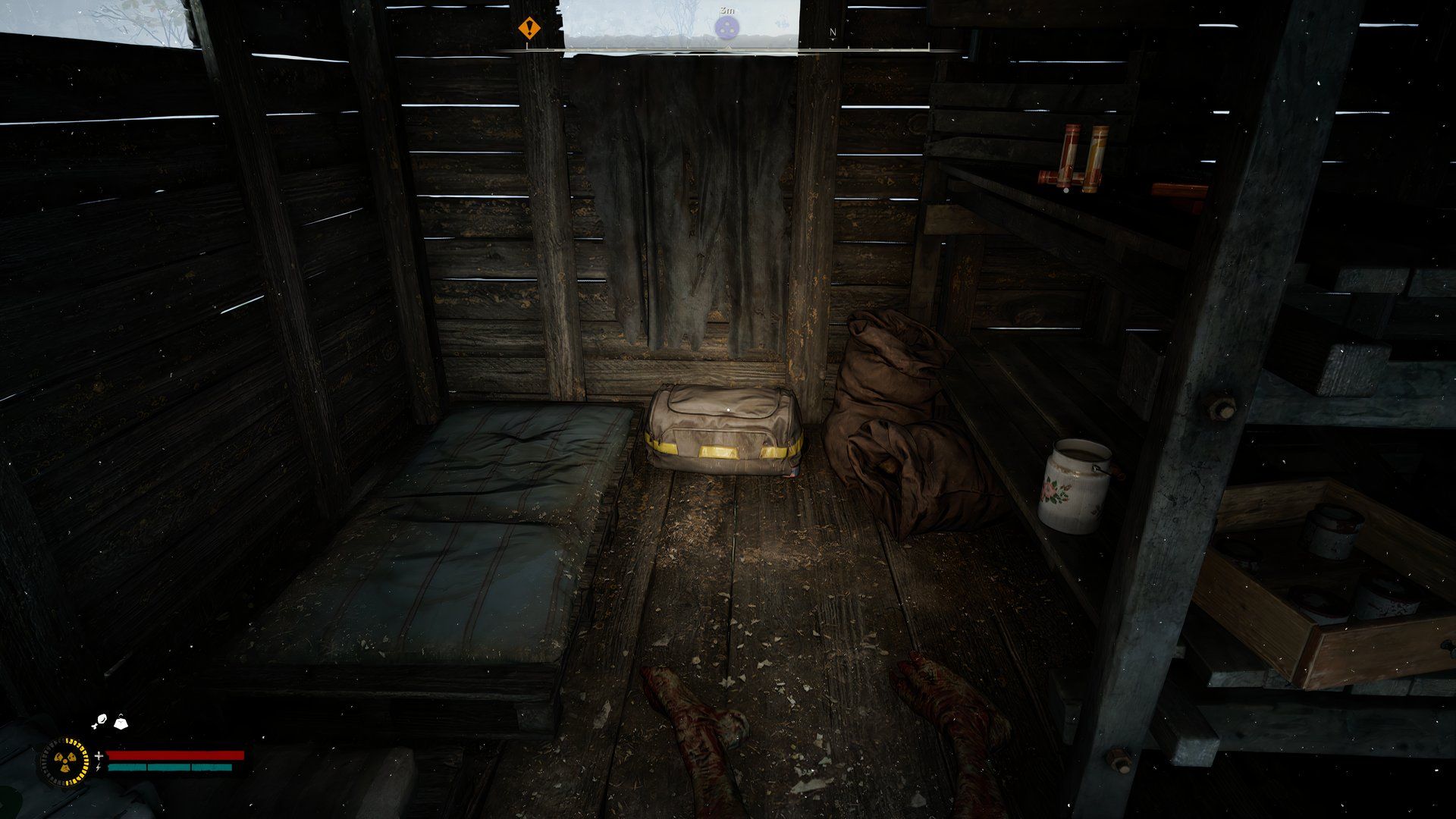 An image showing a stash beside a bed inside a cabin.