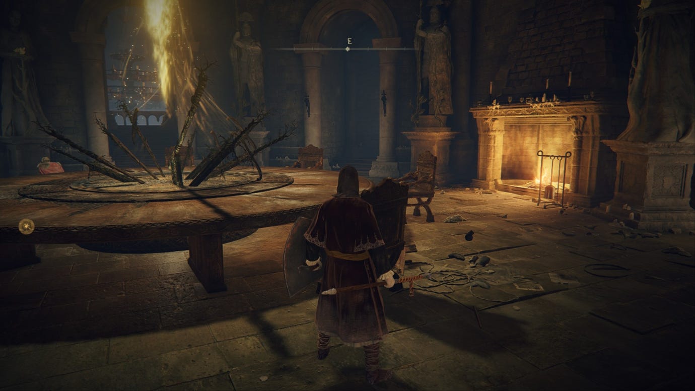 Elden Ring player standing by a large table near a roaring fire in the Roundtable Hold