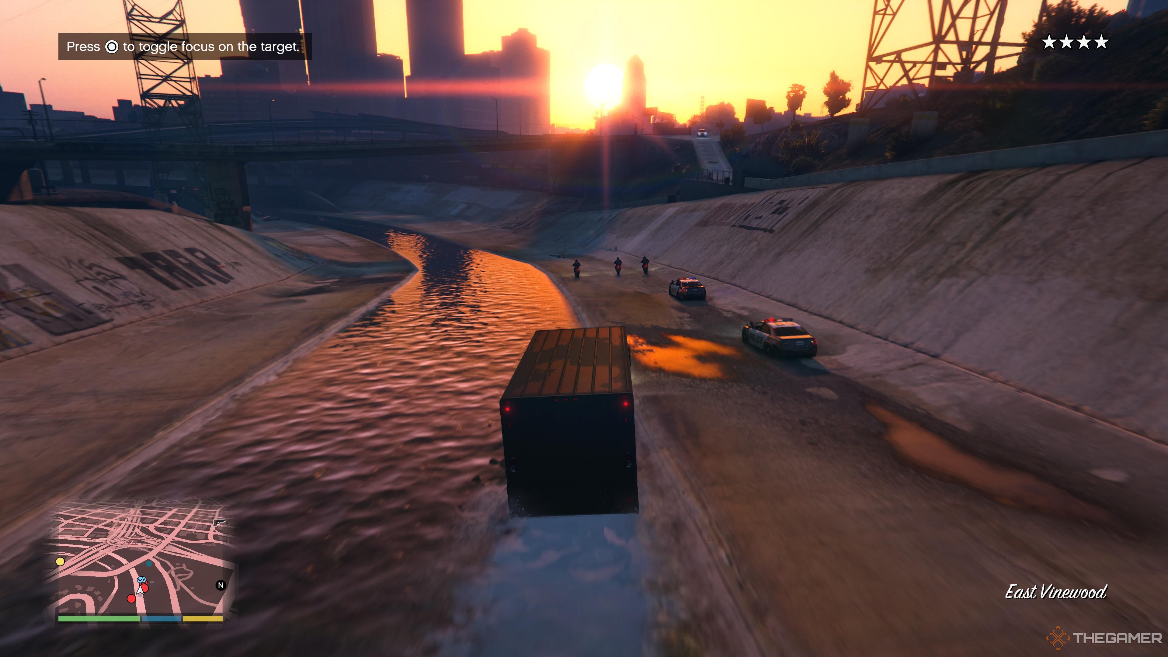 A van and bunch of cops in Grand Theft Auto 5.