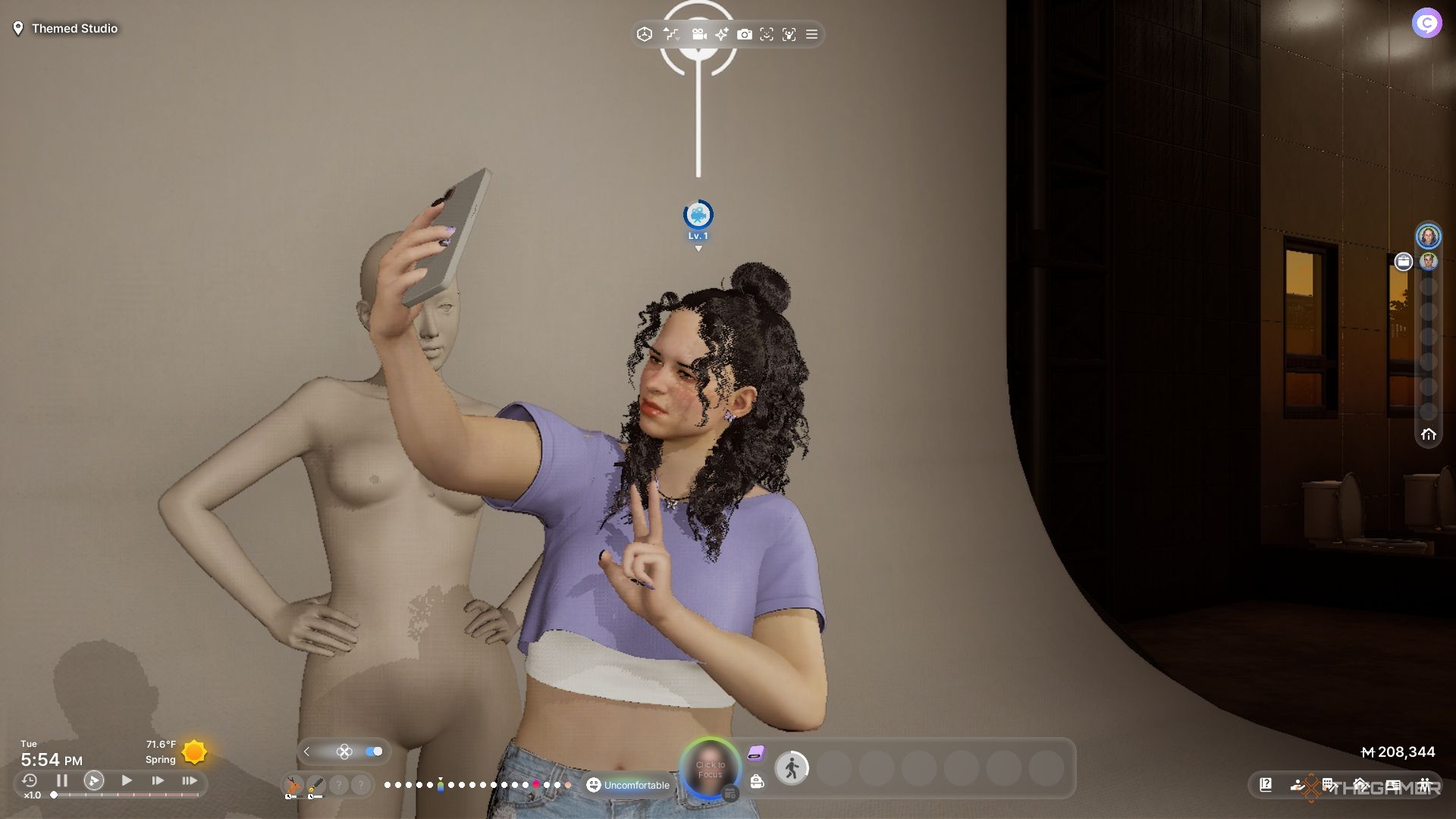 A Zoi taking a selfie with a mannequin and a backdrop.