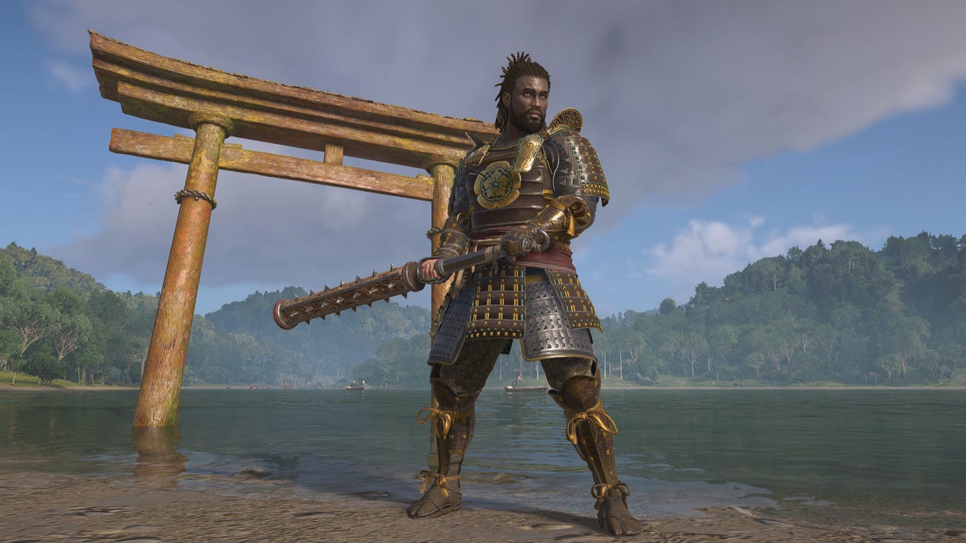 Yasuke stands strong with his kanebo in Assassin's Creed Shadows, in front of a torii gate.