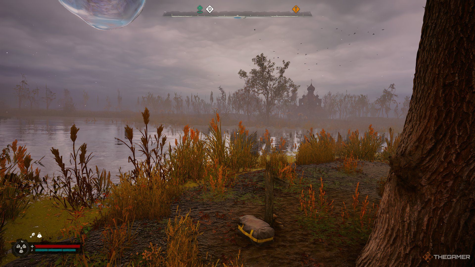 An image showing a grave which has a stash next to it.