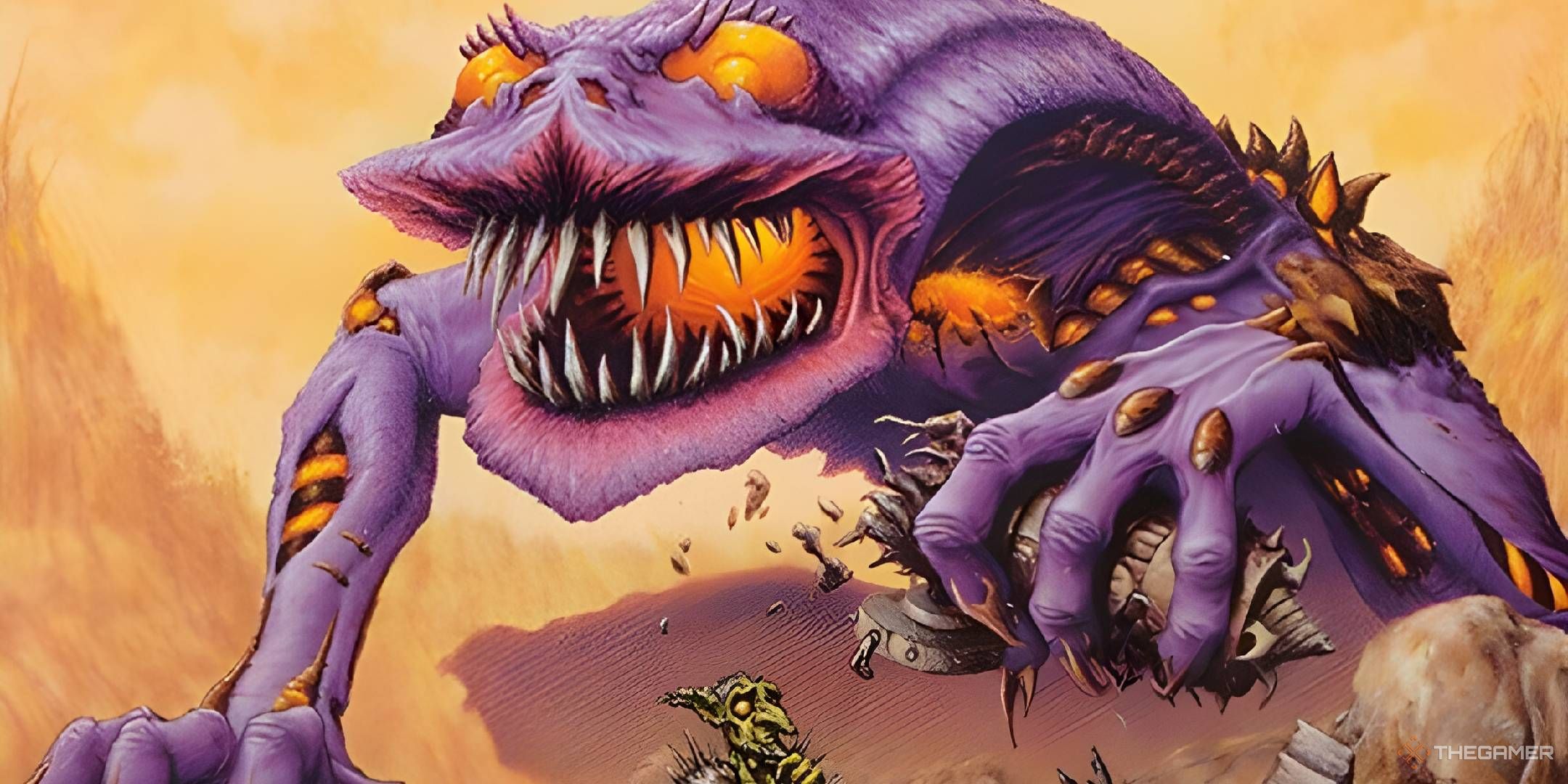 An enormous purple Atog crushes a siege engine with one clawed hand while glaring down at a surprised Goblin.