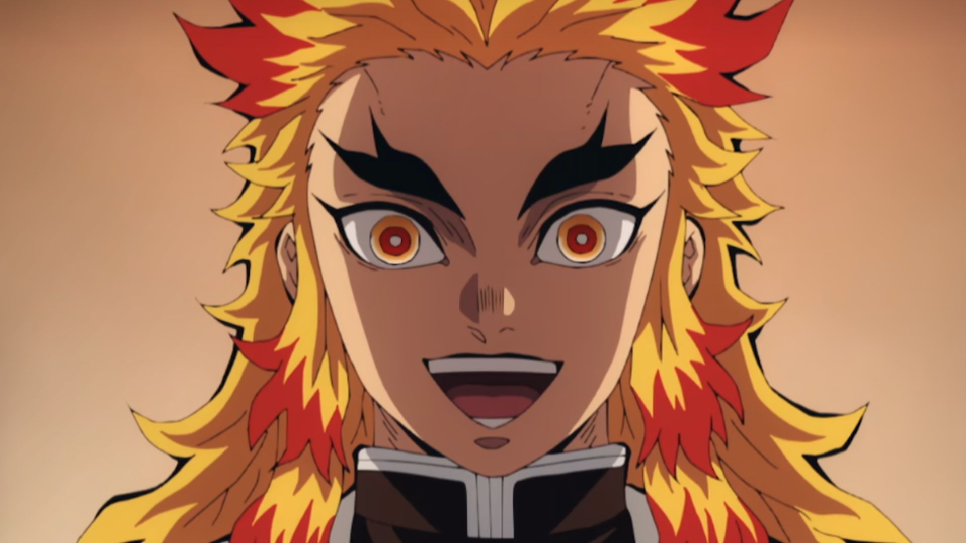 The Flame Hashira Rengoku is smiling in Demon Slayer.