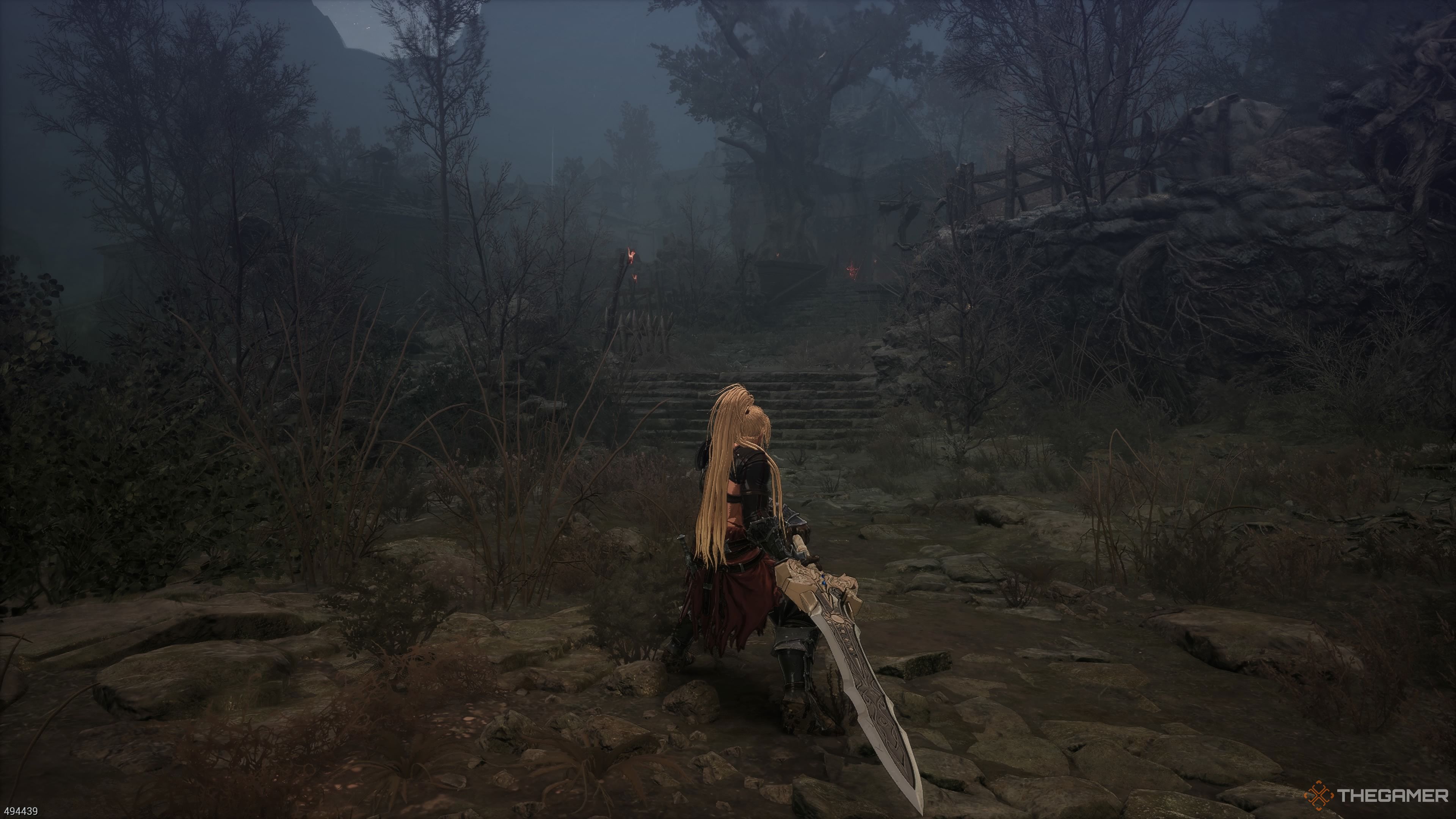 The opening area in the Devoured Village section of The First Berserker Khazan.