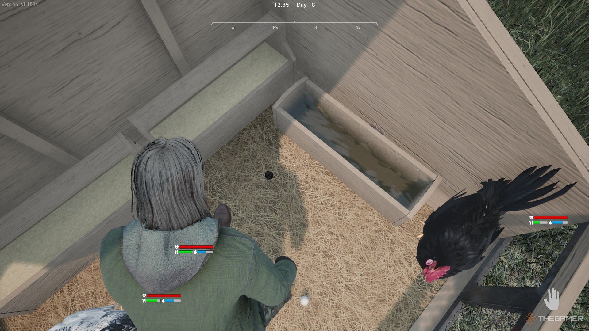 The player is inside a coop and looking at food and water troughs in Ranch Simulator