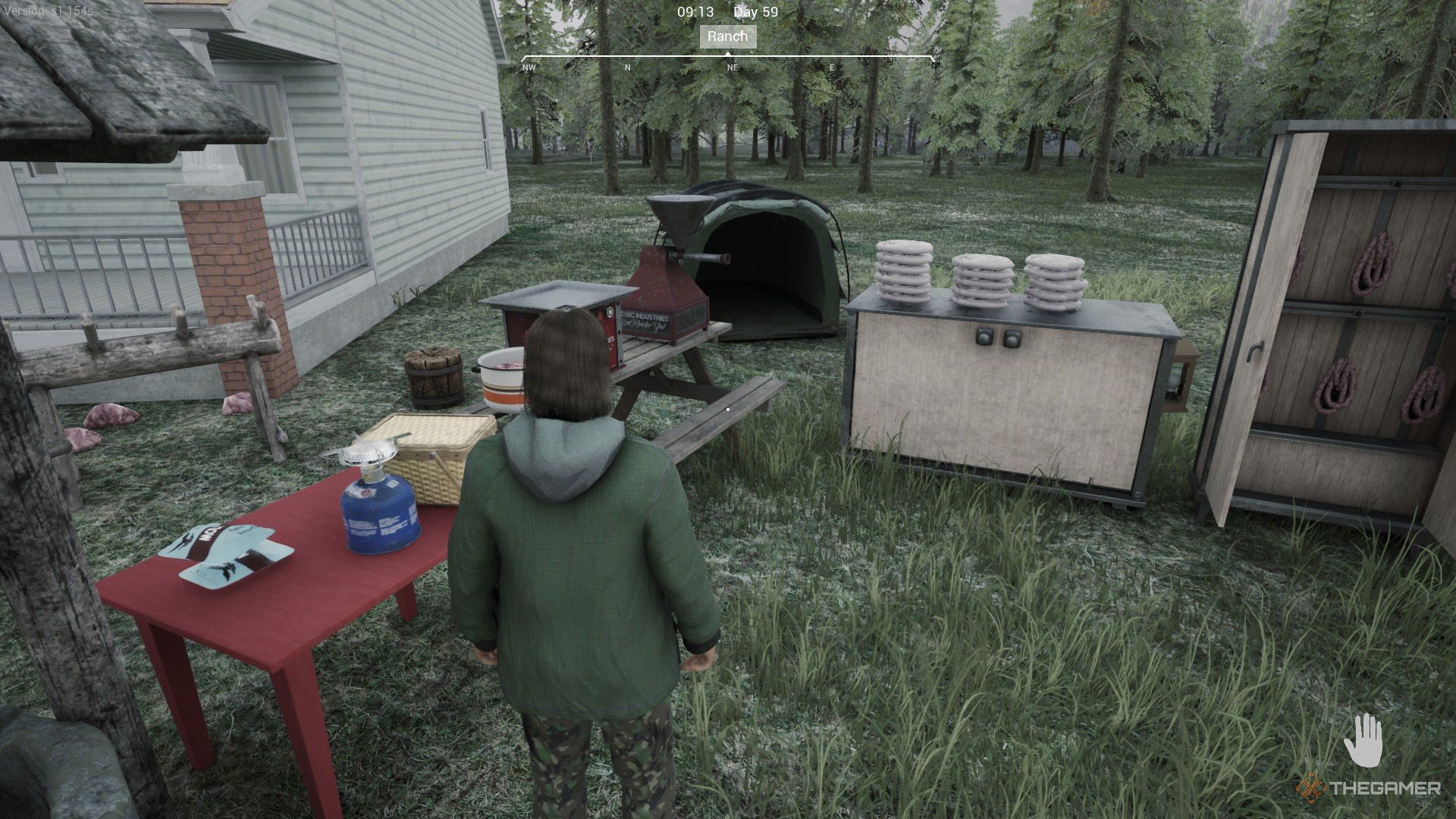 The player is standing next to the equipment used for processing meat in Ranch Simulator