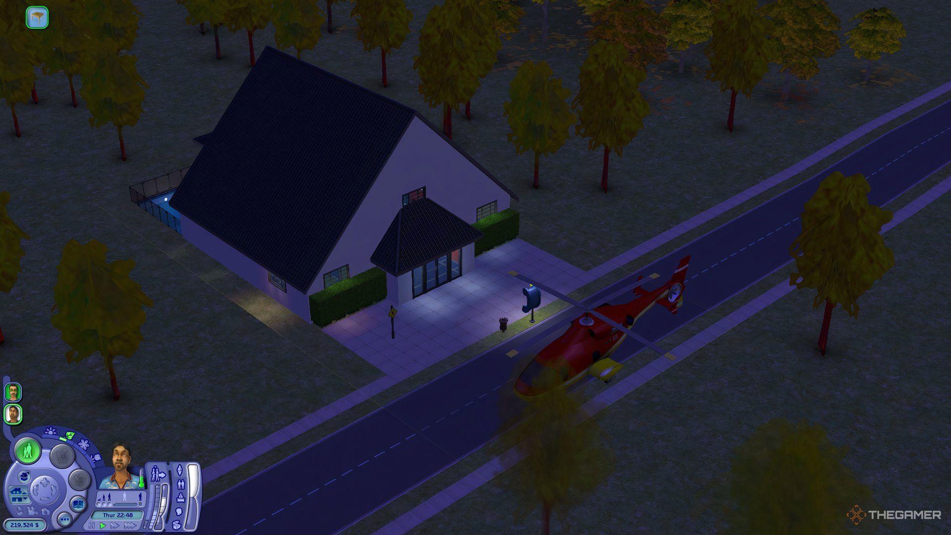 An overhead view of the games of glory hobby club at night with a helicopter outside.