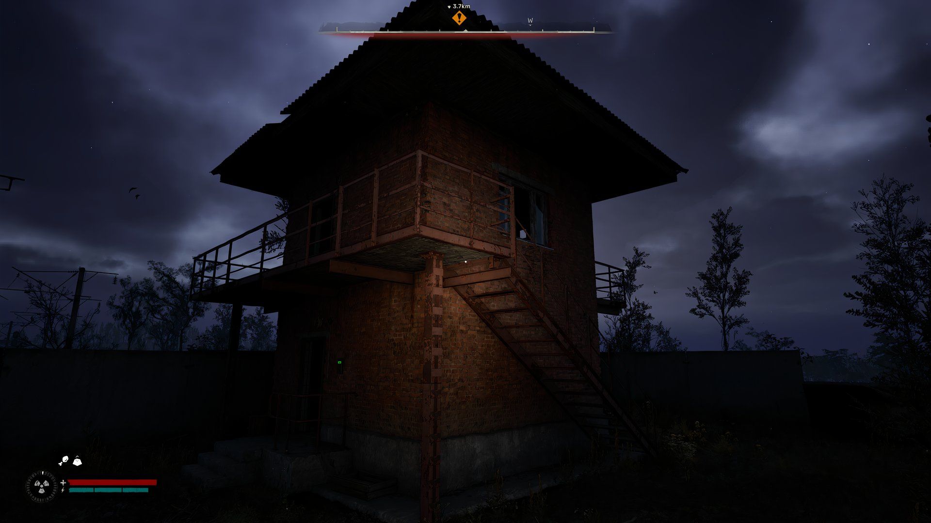 An image showing a small lookout tower next to railyard.
