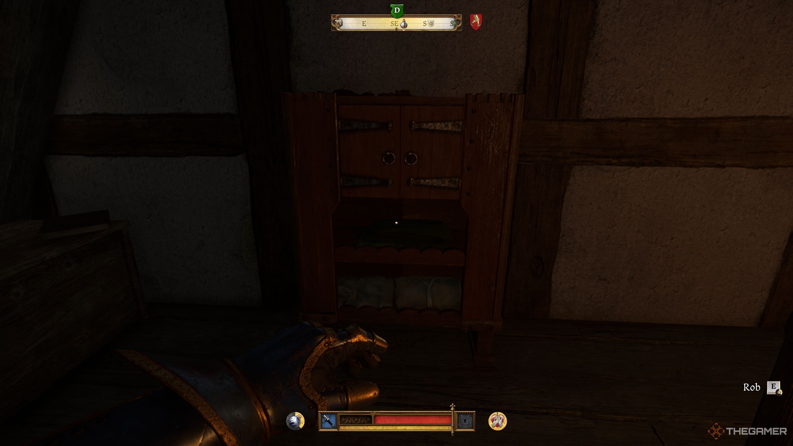 Henry standing before a wooden cabinet in Kingdom Come: Deliverance 2.