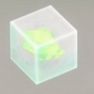 A chunk of Xenopetrium sits in a glass case in Sims 4
