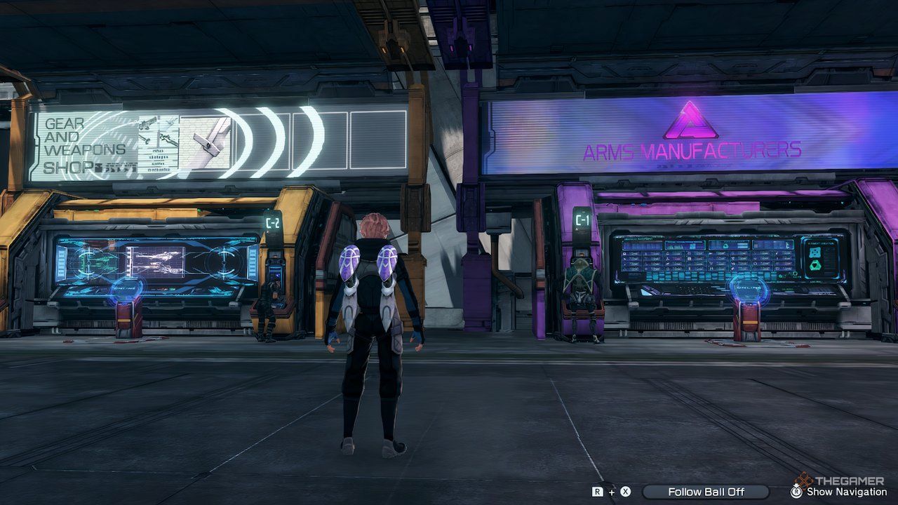 The player avatar standing in front of the two shop concourses in Armory Alley in Xenoblade Chronicles X: Definitive Edition.