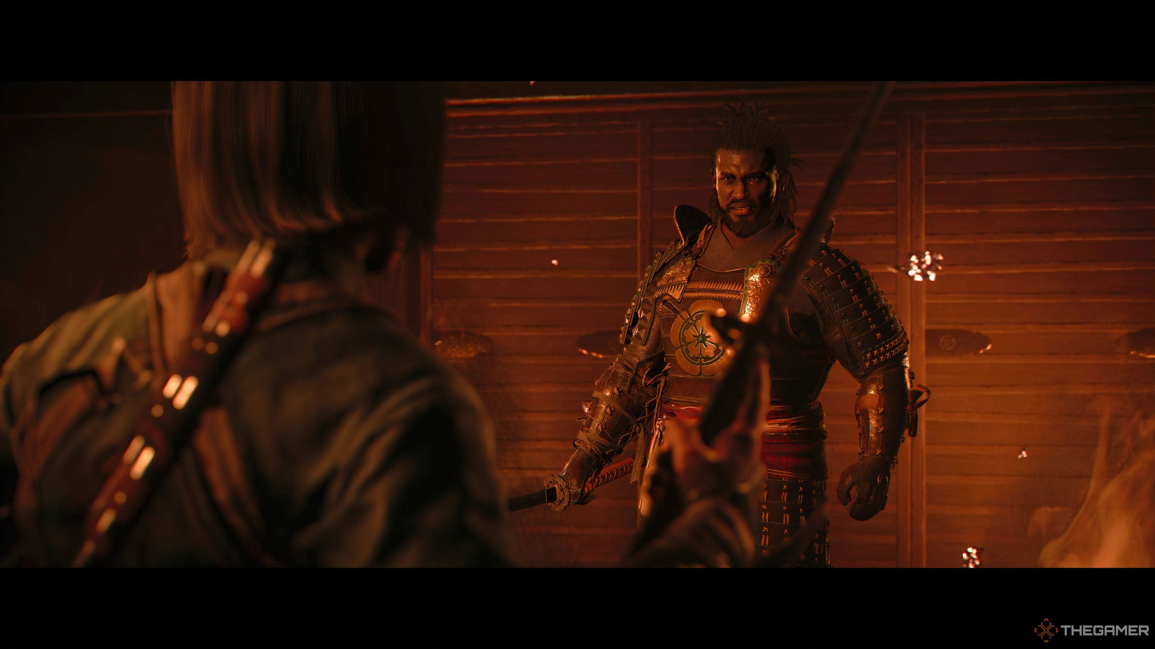 Yasuke looking at Naoe in a burning building during a cutscene in Assassin's Creed Shadows.