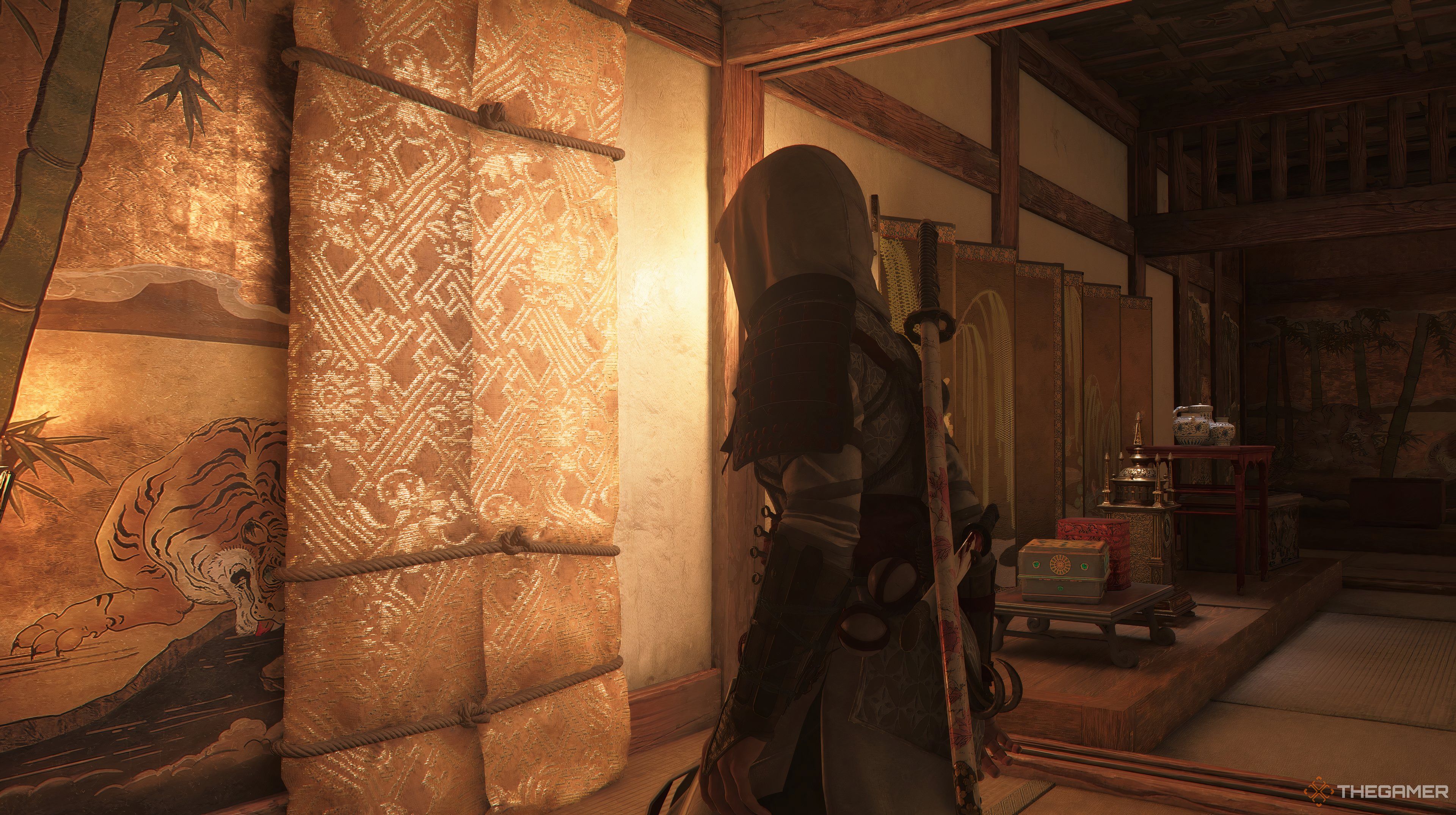 Naoe in a large room looking at a painting. 
