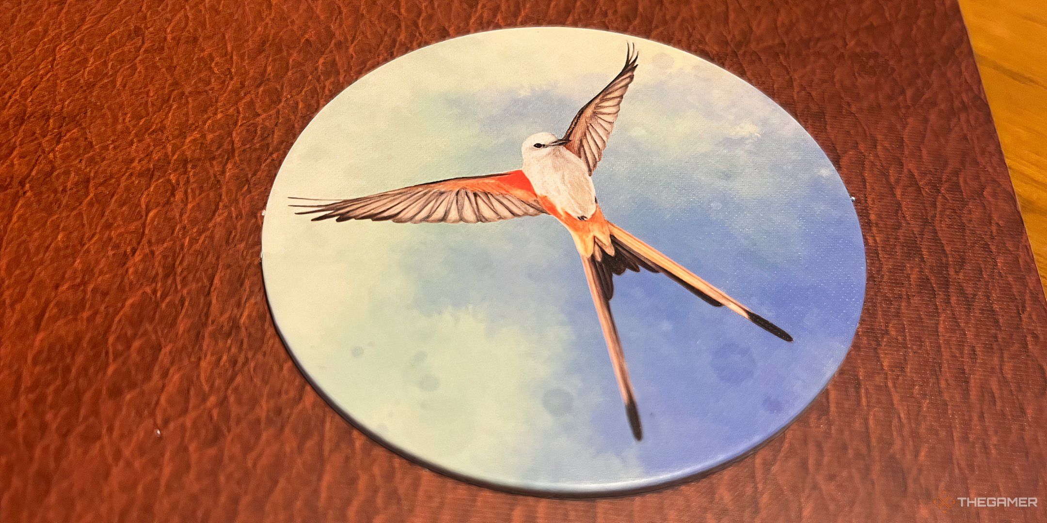 The starting player token in Wingspan.