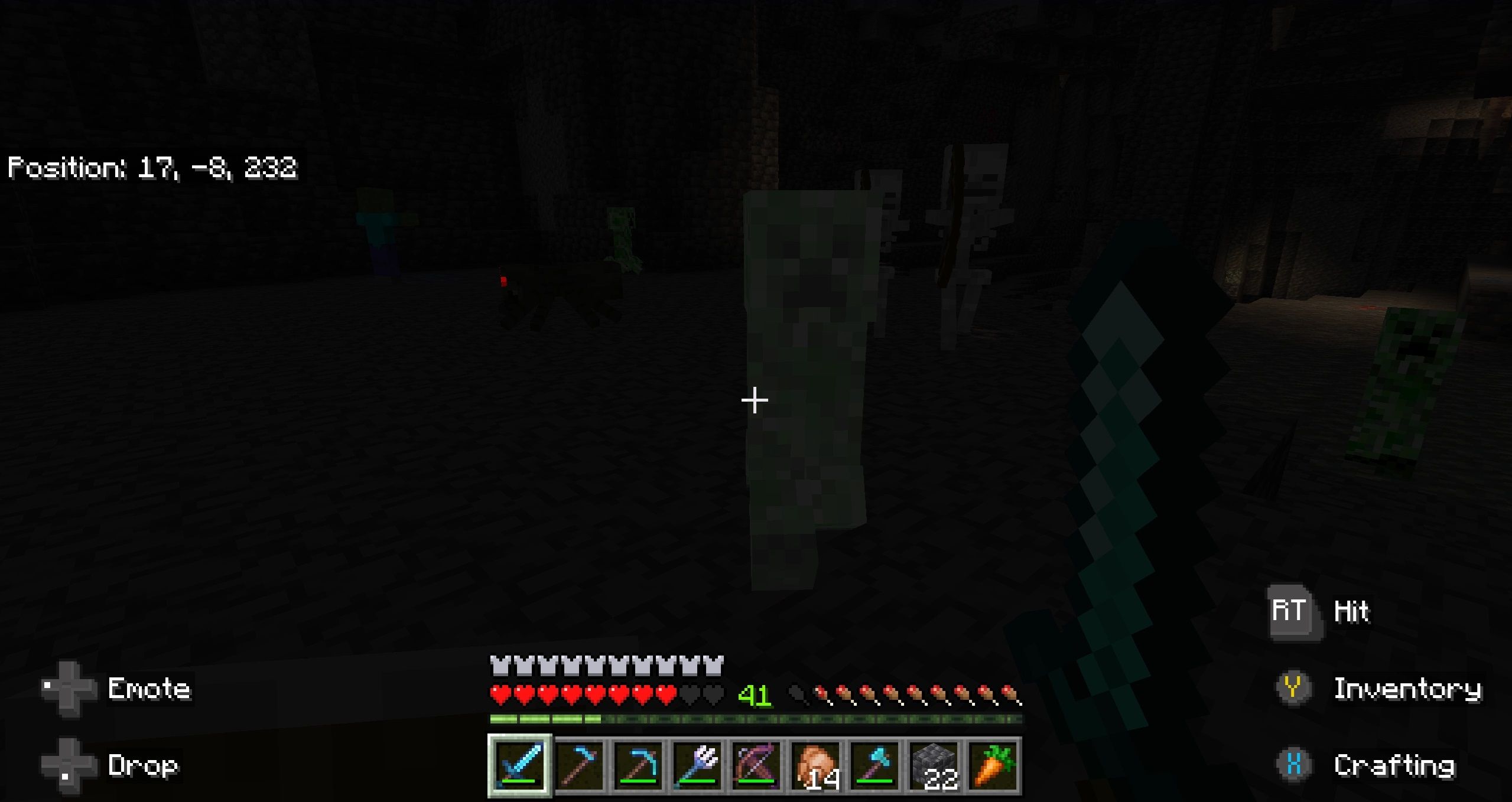 A group of enemies consisting of skeletons, spiders, zombies, and creepers in a very dark cave. The creeper in front is getting ready to explode in Minecraft.