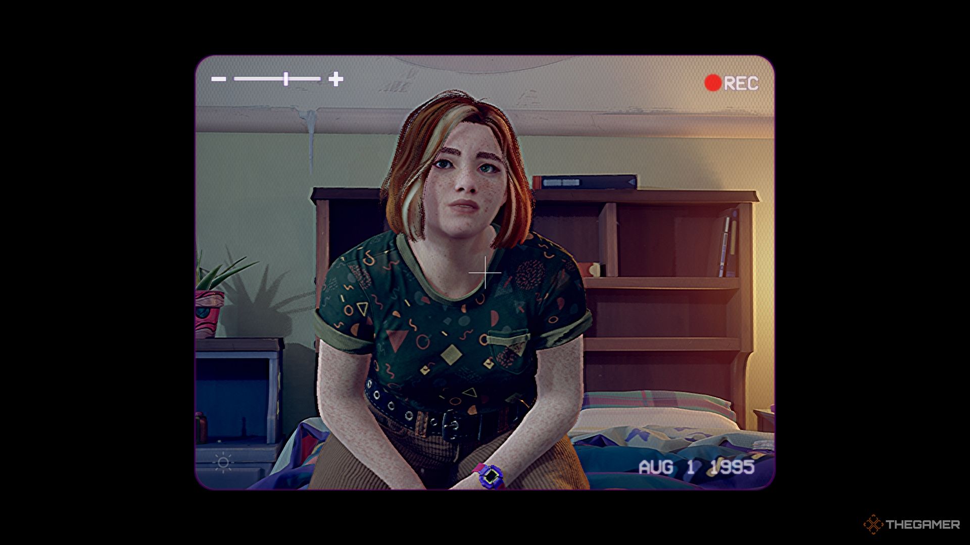 Swann sitting on her bed in front of the camera.