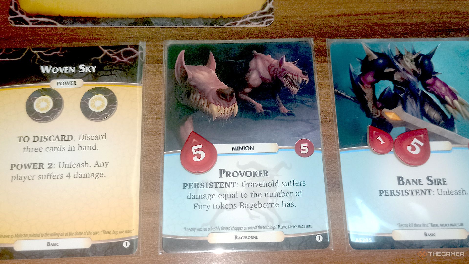 Provoker, Bane Sire and Woven Sky cards next to each other in Aeon's End.