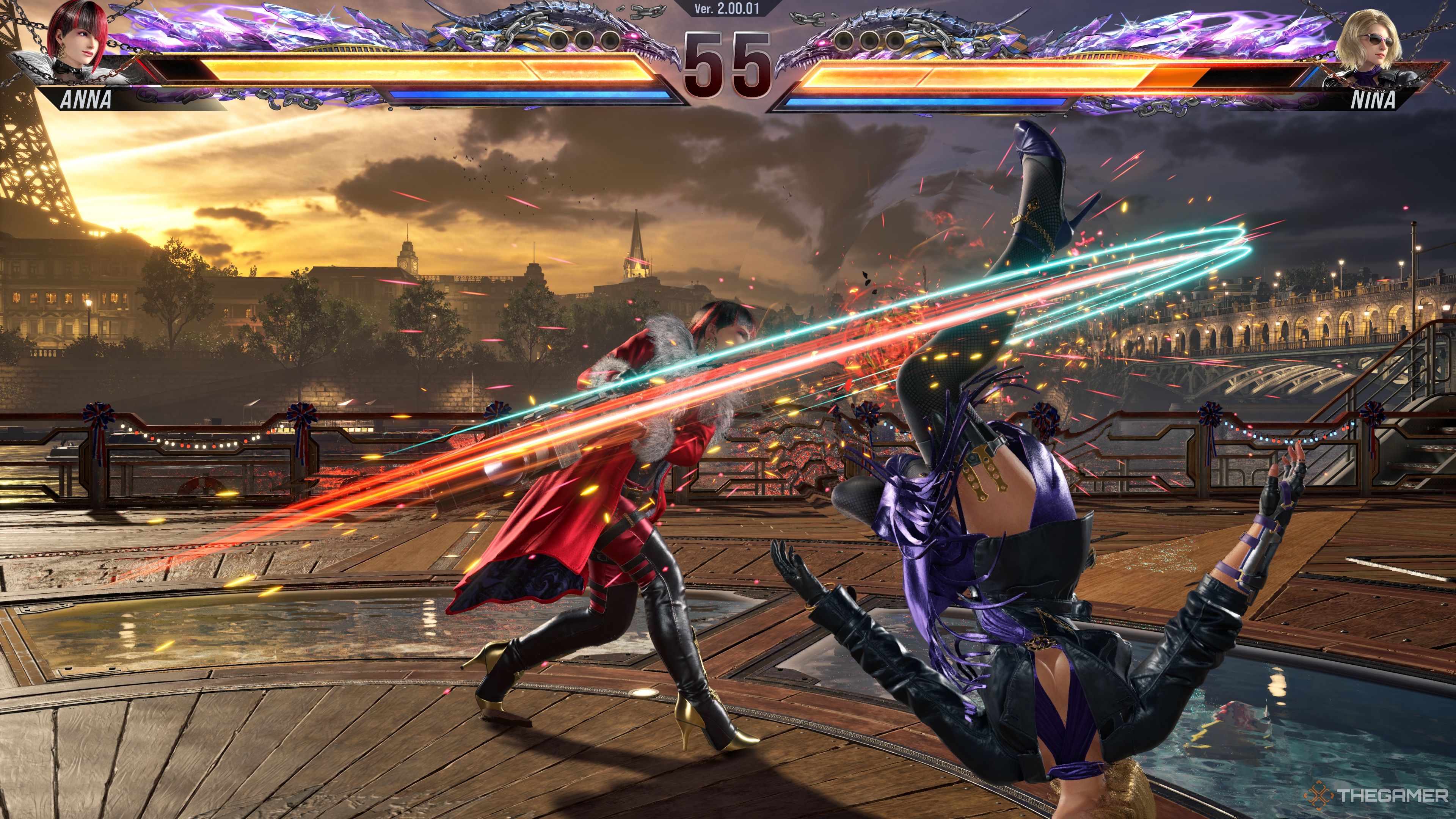 Anna Williams hitting Nina Williams with her Headless Horseman attack, knocking her down by hitting her with her rocket launcher.