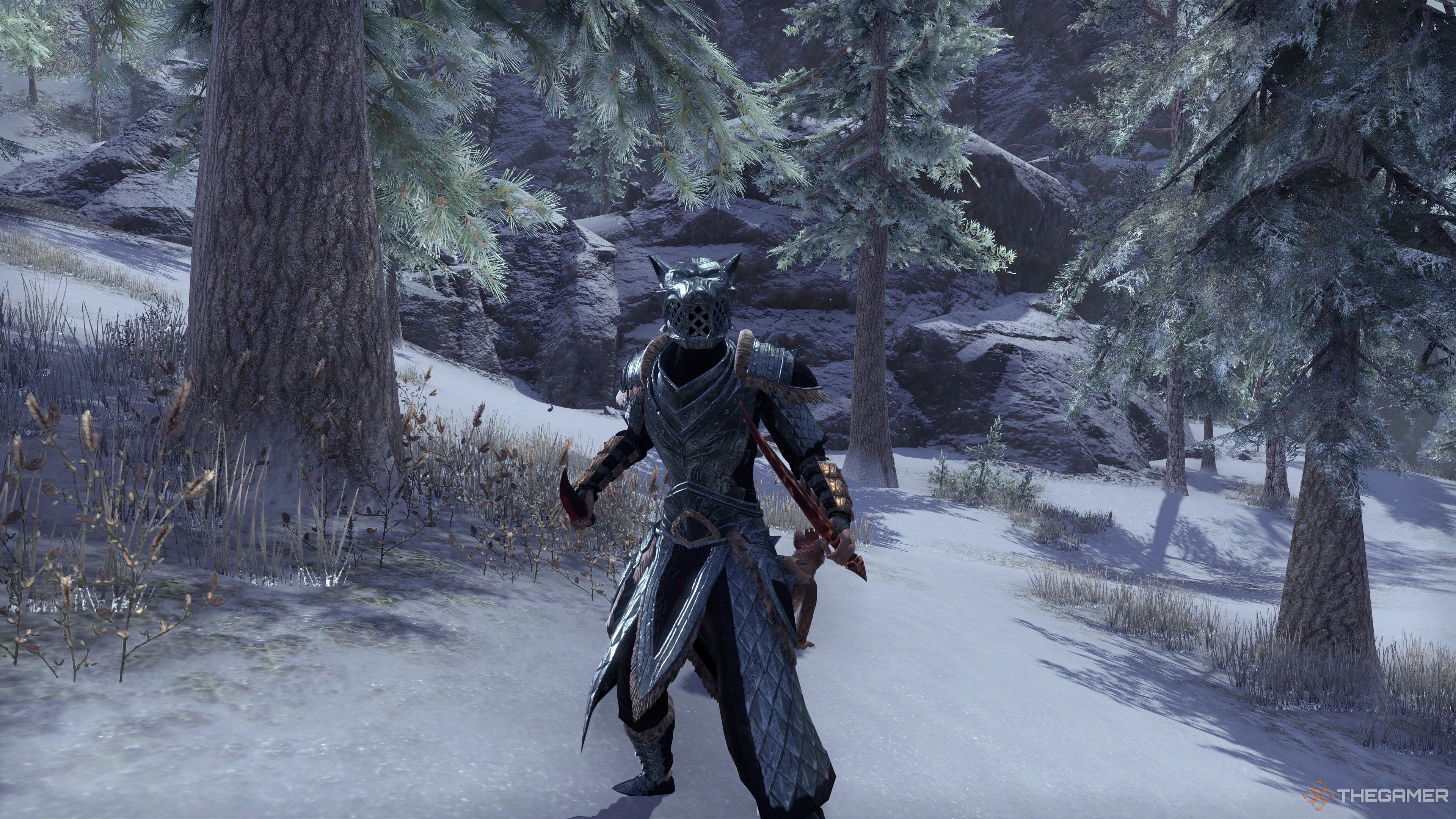 Templar wielding dual daggers in steel scale wolf armor. She stands in a snowy environment with trees and rocky mountains behind her.