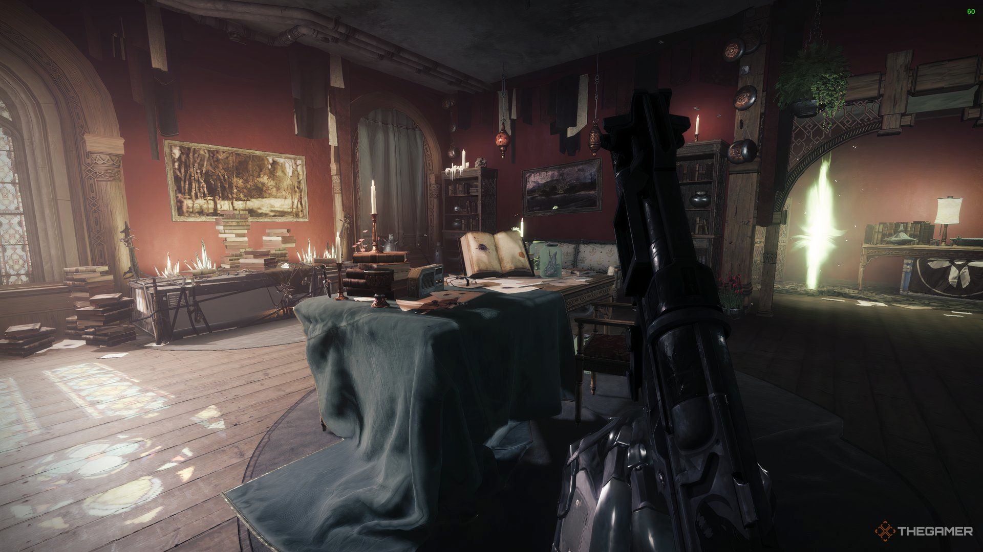 An overview of Eris' Living Room with a desk, a lot of candles, books, and a portal leading to her Throne World in Destiny 2: Heresy.