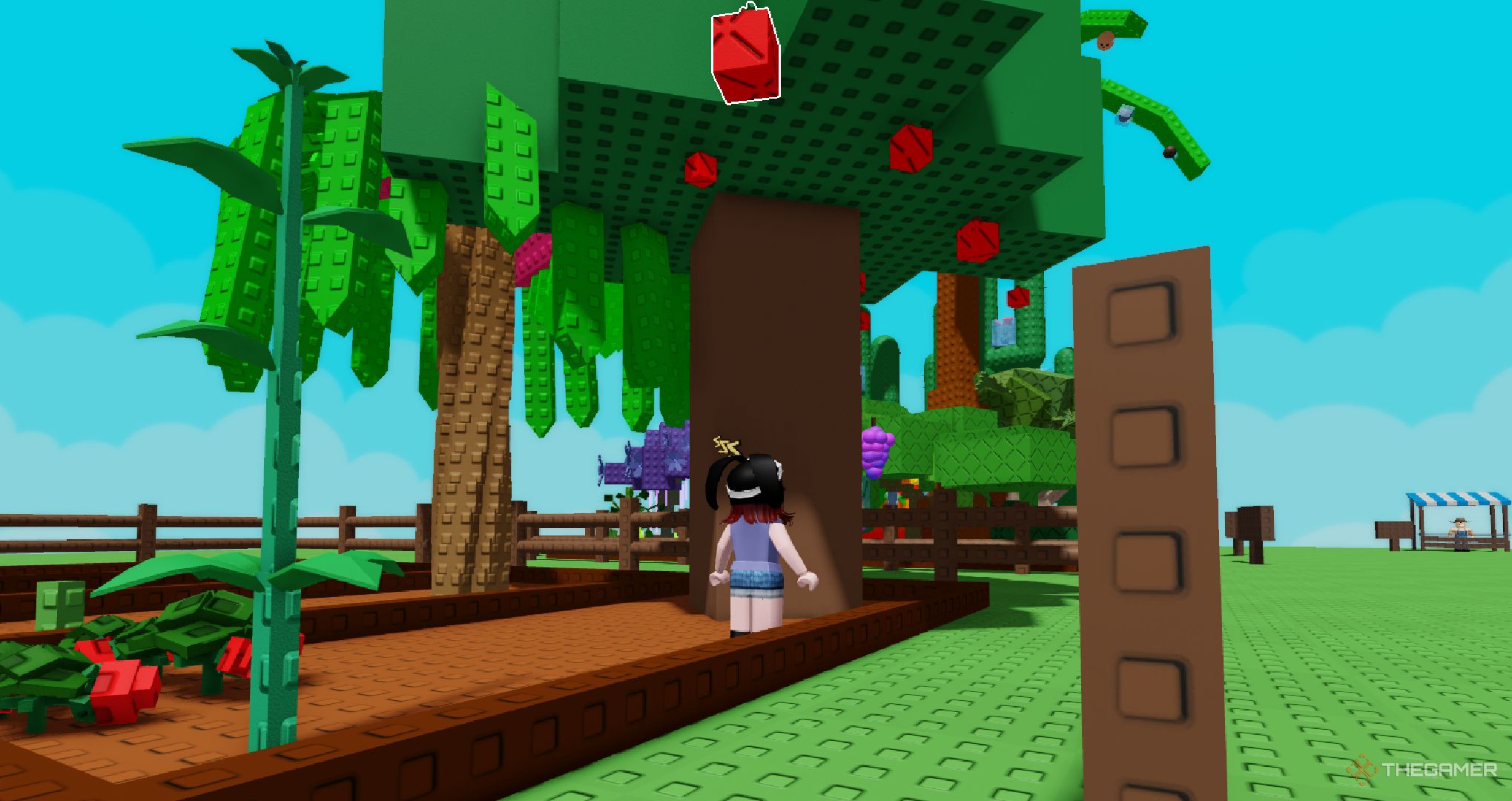 A player near an apple tree in Roblox Grow a Garden.