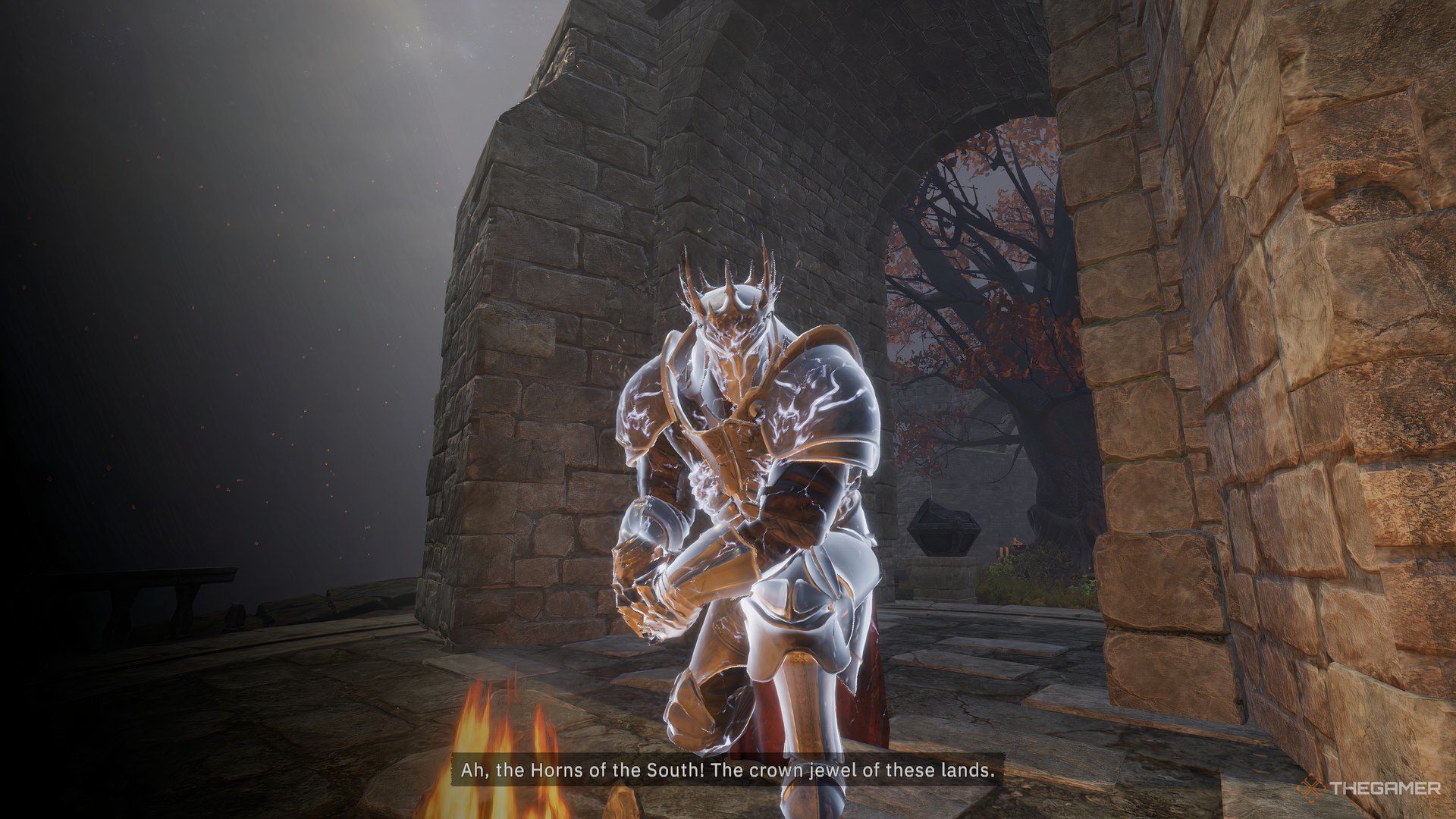 Tainted Grail Fall of Avalon Arthur crouched at a campfire.