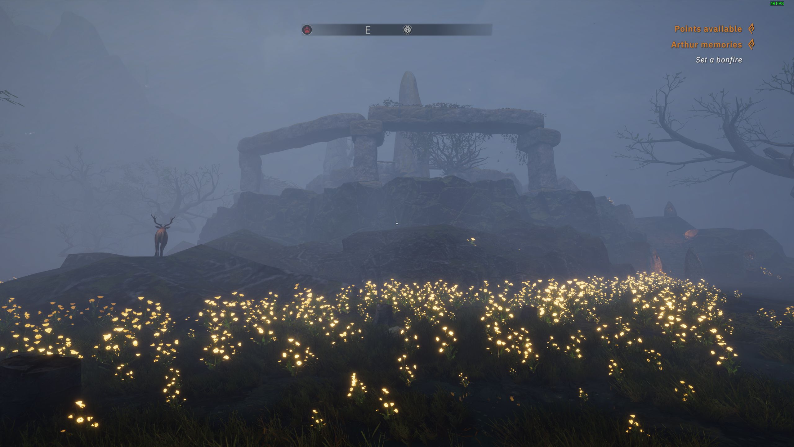 A stone structure besides a field of flowers at night in Tainted Grail: The Fall Of Avalon.