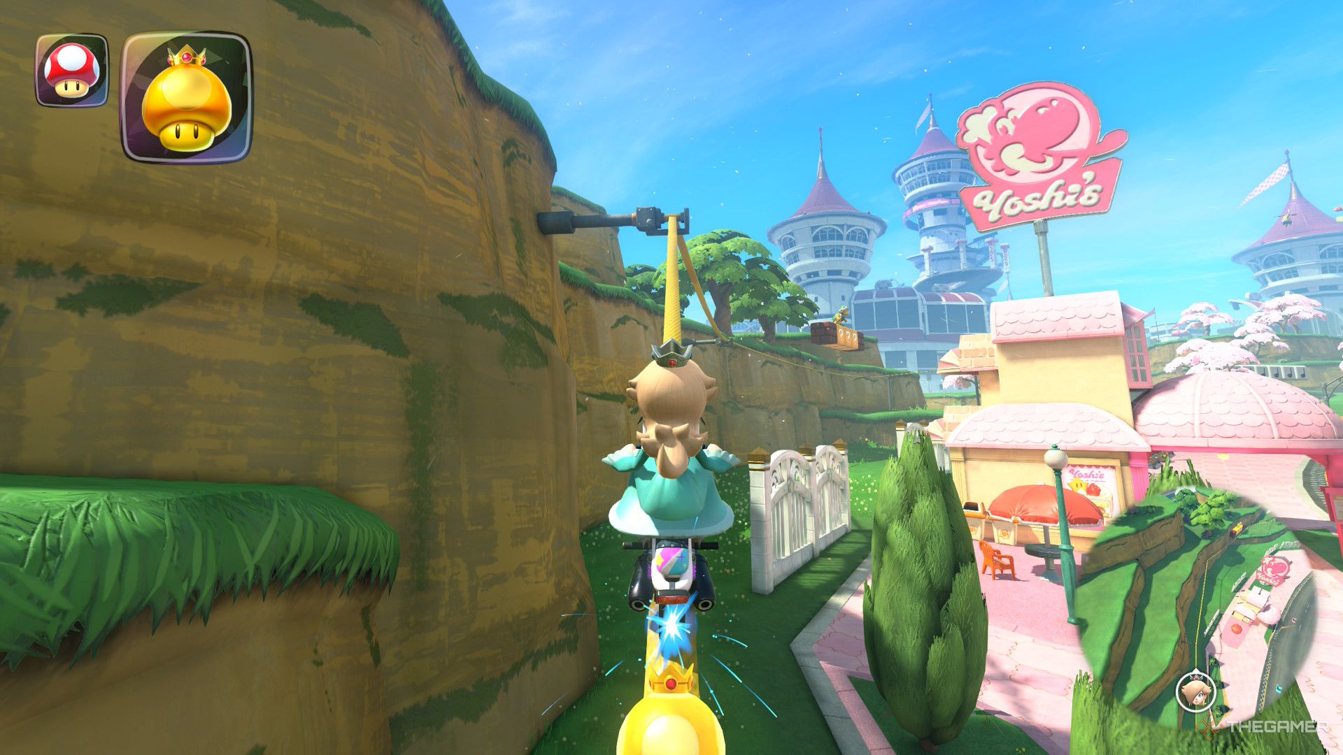 Rosalina rides a rail near Yoshi's diner in Mario Kart World.