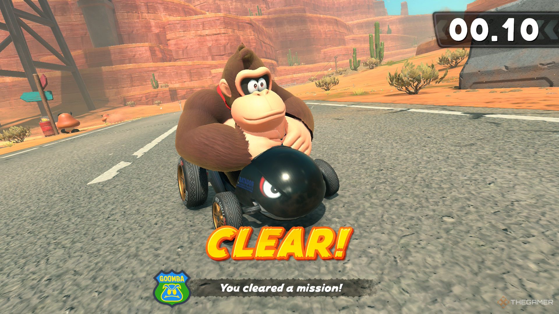 Donkey Kong in a small kart beating a mission in mario kart world.