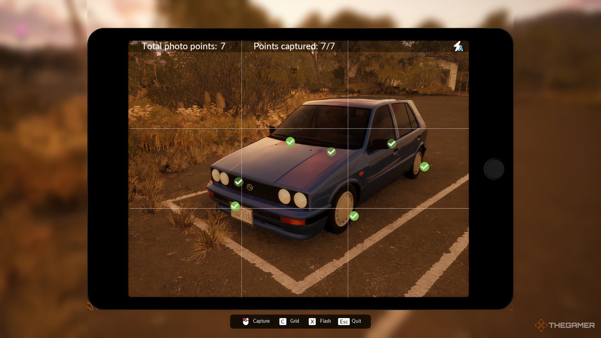 A photo of a car is being taken on a tablet in Car Dealer Simulator