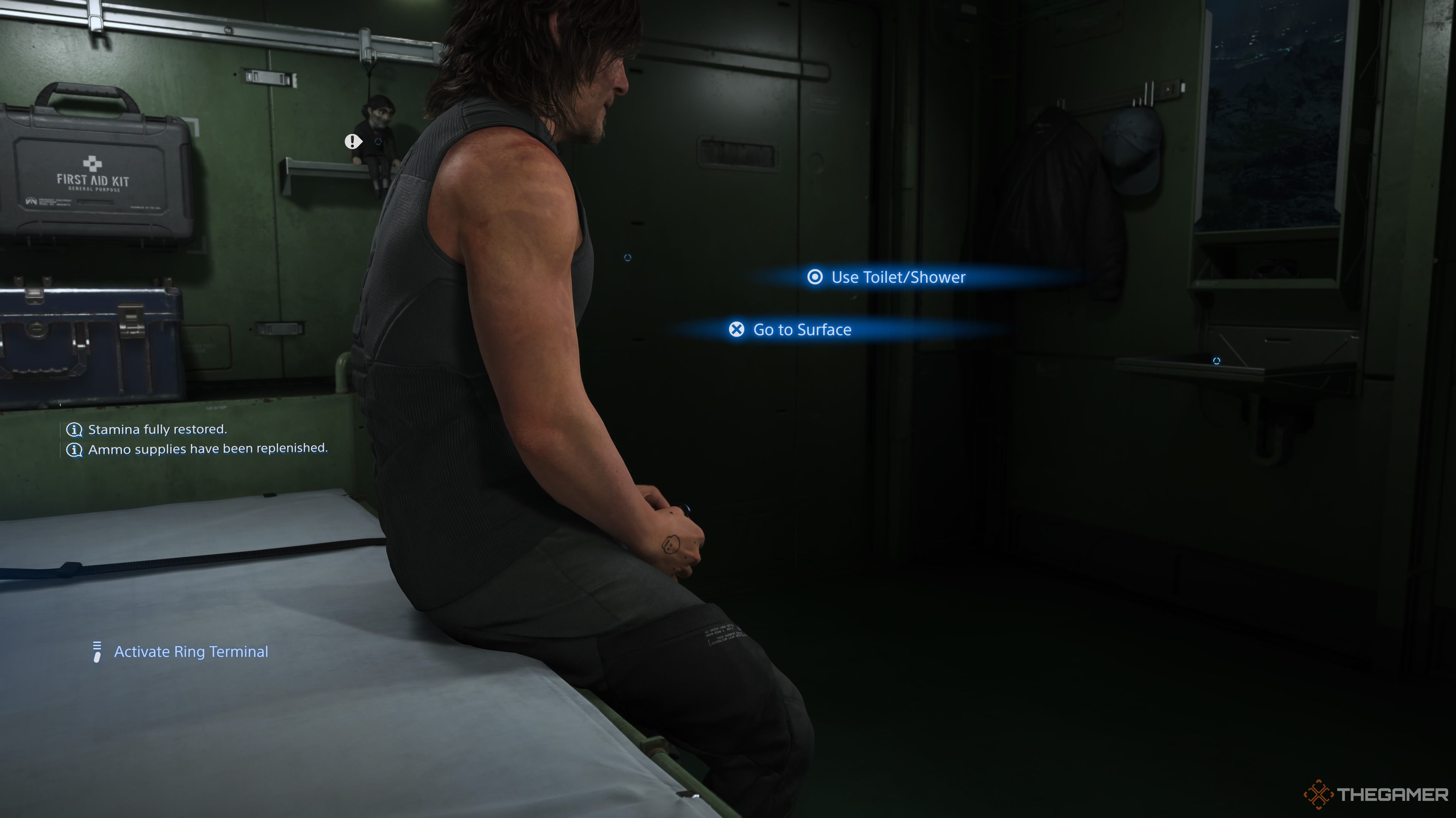 Death Stranding 2 On The Beach Sam looking at the main door.