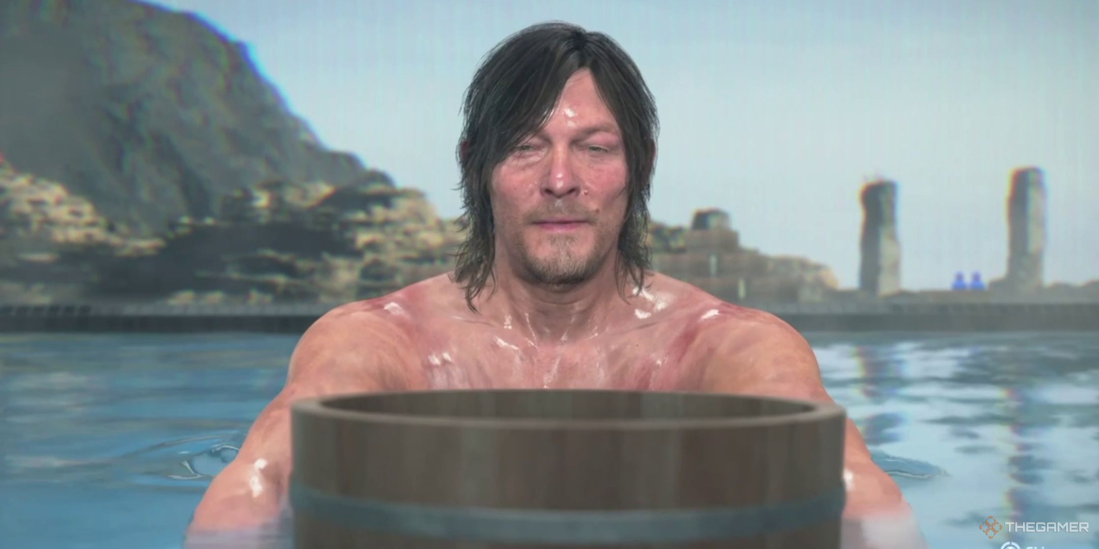 Сэм готовится совершить прыжок из горячего источника в Death Stranding 2. 