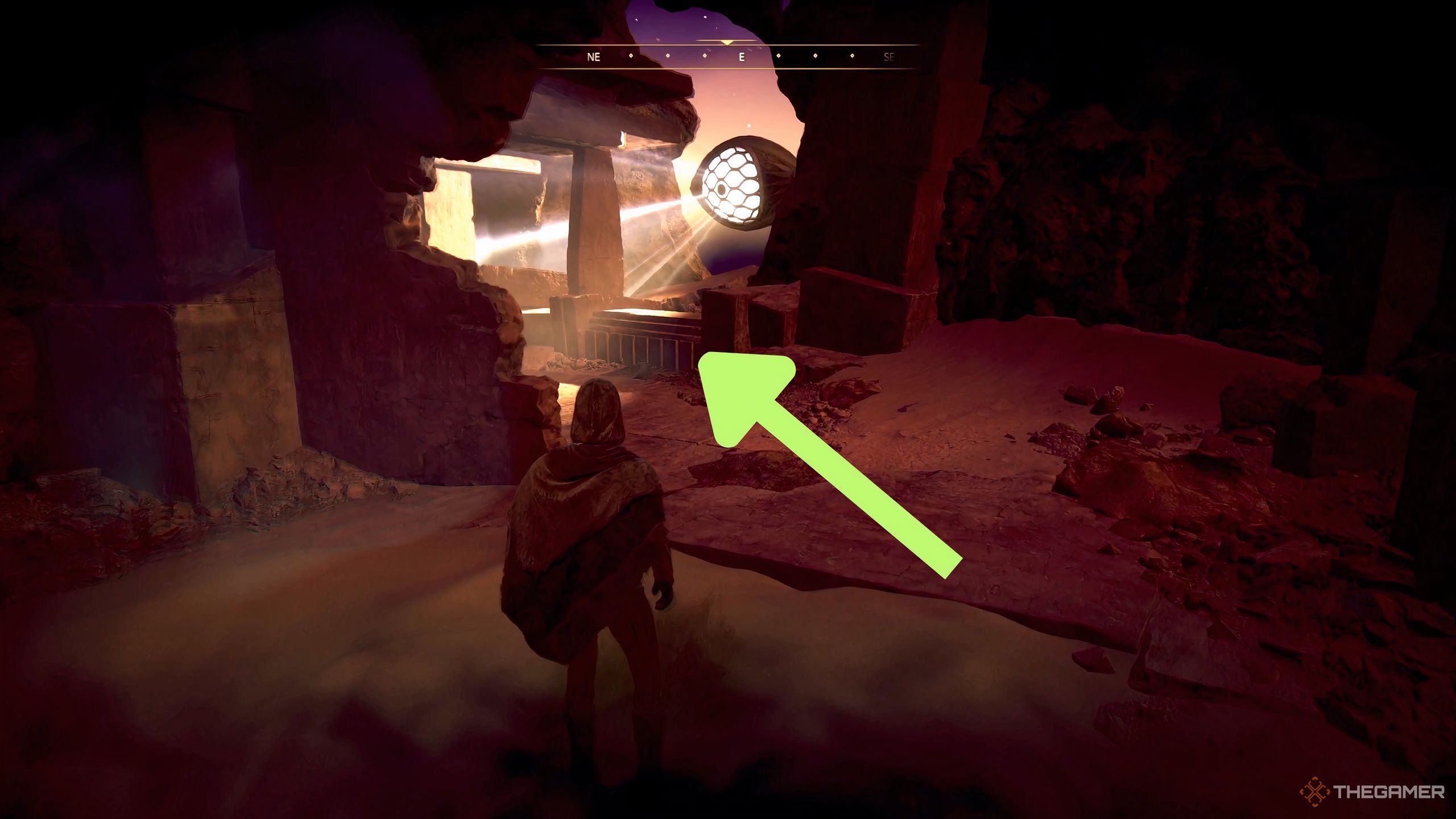 A lower third wall that a player can hide behind with a green arrow pointing at it in Dune: Awakening.