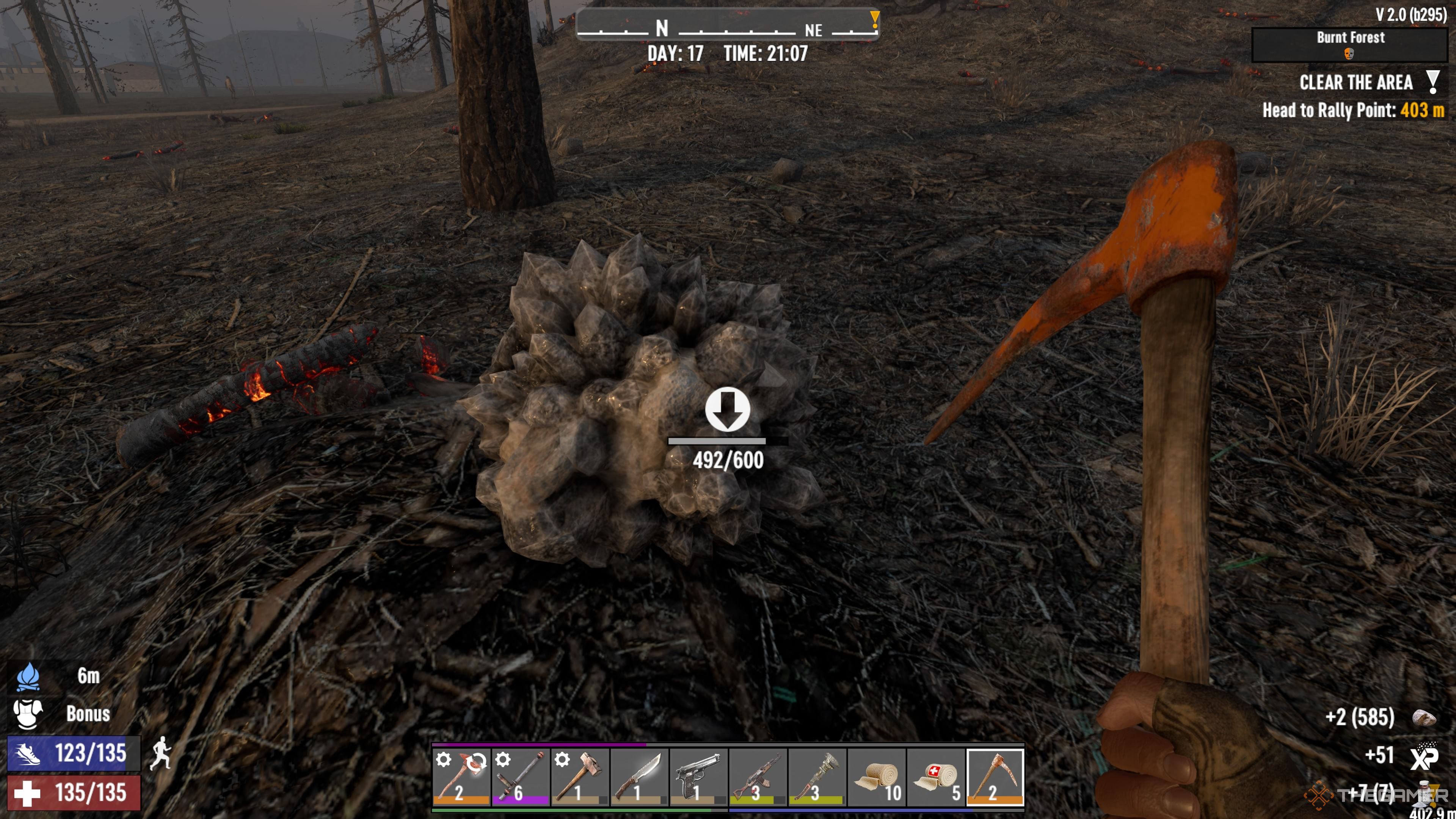 Player character using an Iron Pickaxe to mine and break a Nitrate Crystal in the Burnt Forest in 7 Days To Die.