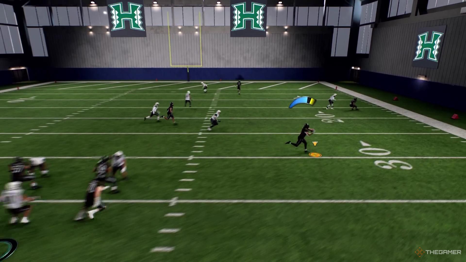 A receiver catches a ball on a drag route in College Football 26.