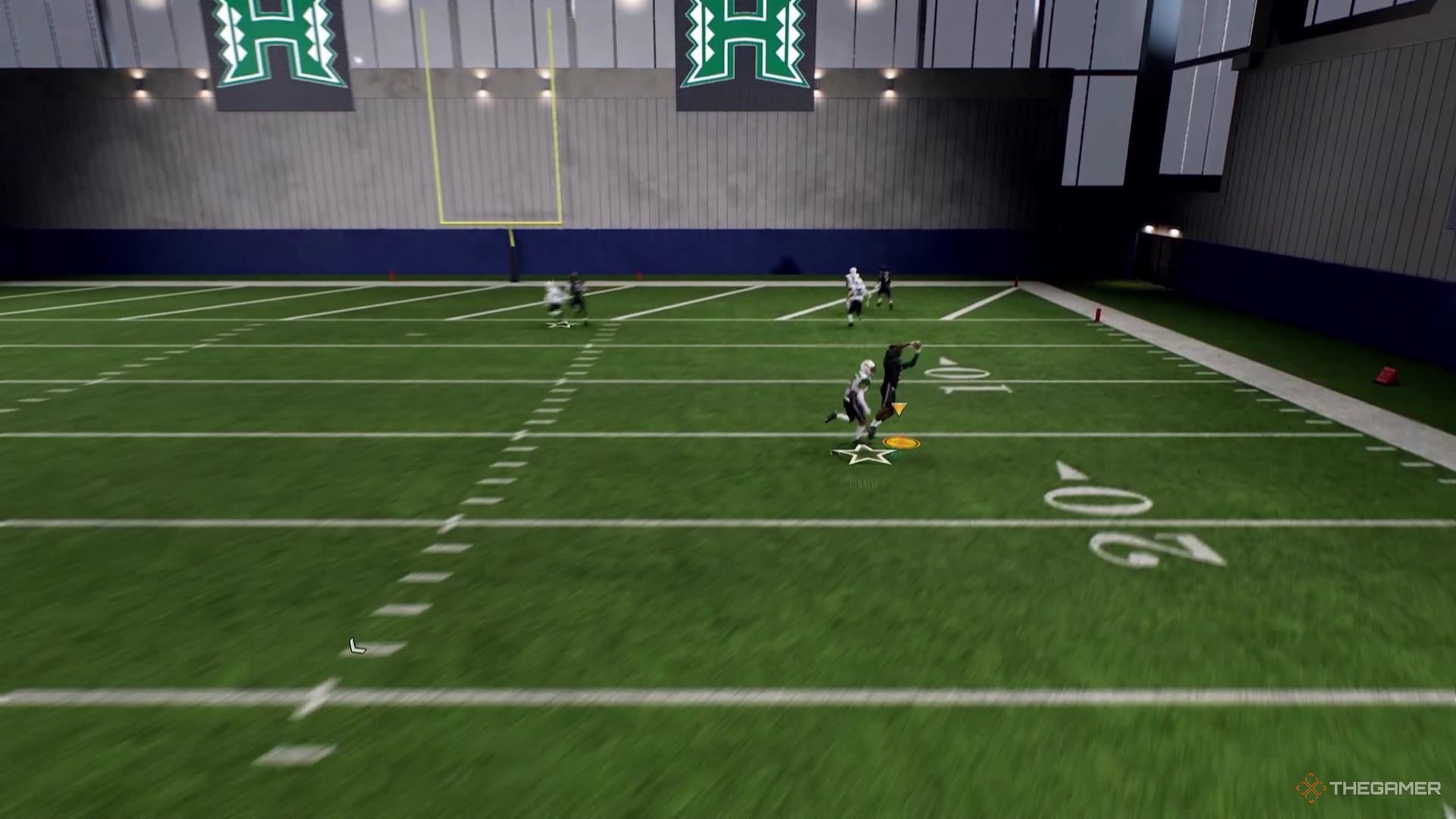 A receiver catches a football on the right side of the field in College Football 26.
