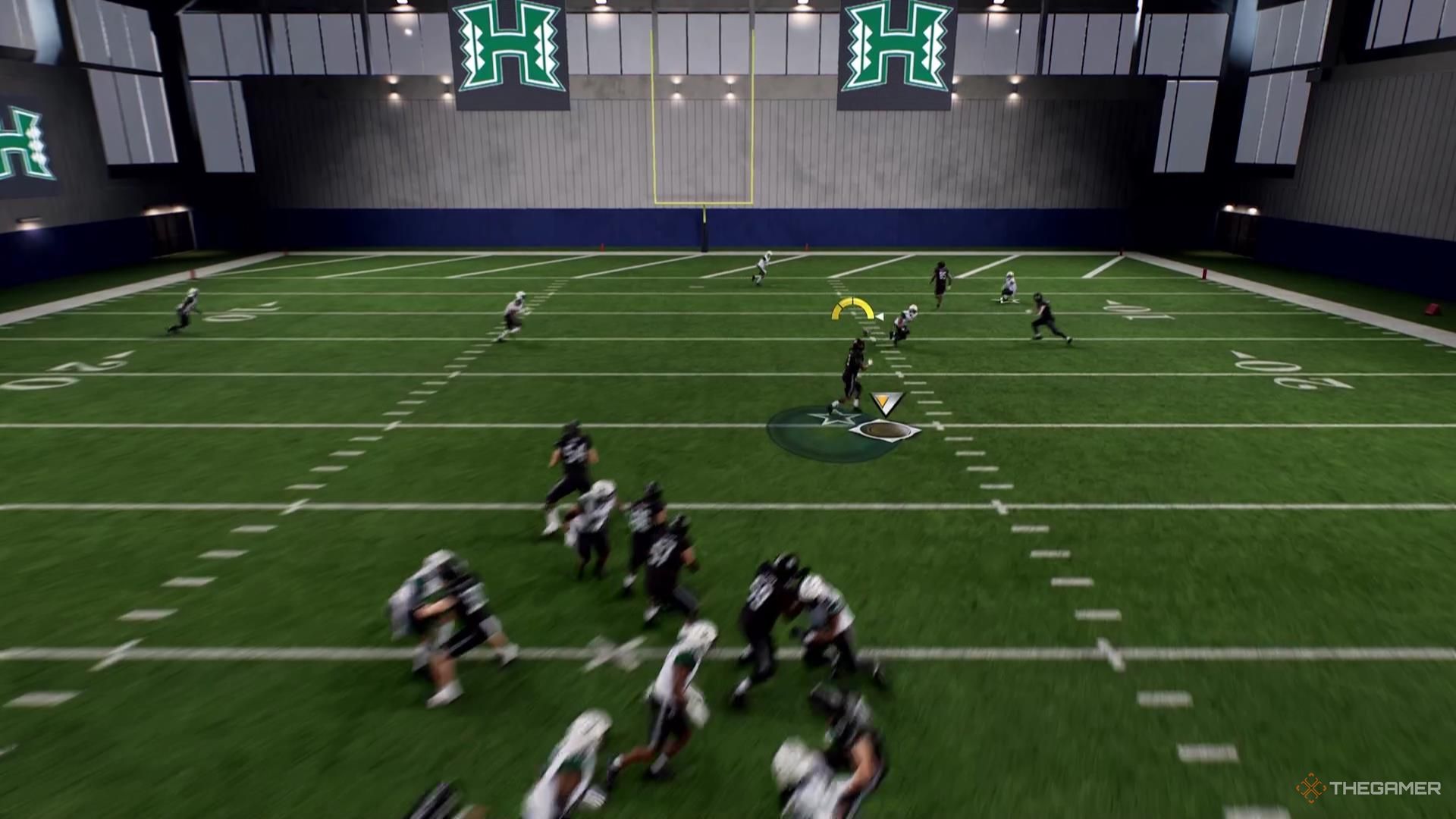 A receiver catches the ball near the right hashmark in College Football 26.