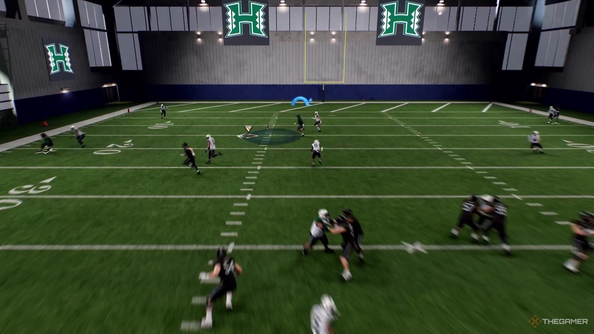 A receiver runs toward a ball near the left hashmark in College Football 26.