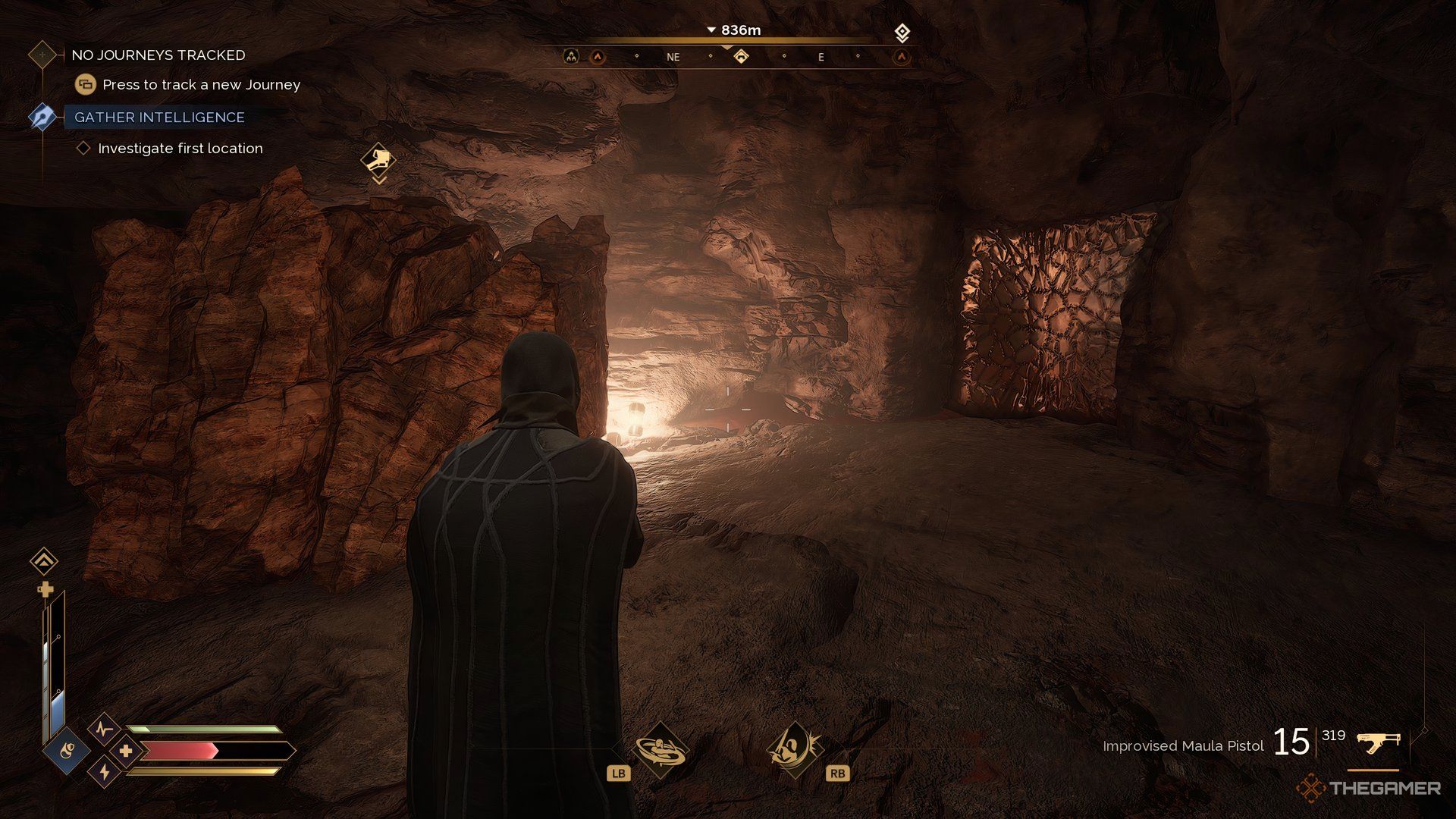 Player at one of the entrances of Ghanima Cavern in Dune: Awakening. There is a rock on the left of the player.