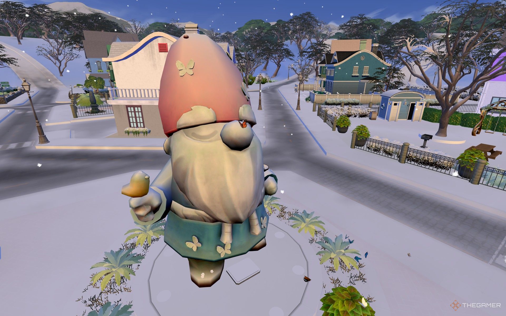 The Great Gnome in the winter with a butterfly on its nose in The Sims 4 Enchanted by Nature.