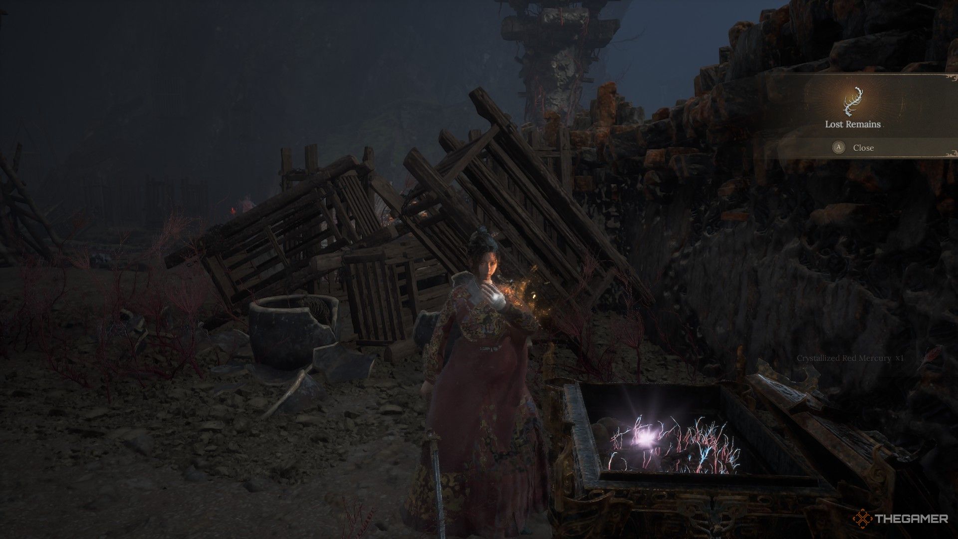 Wuchang picks up Lost Remains from a chest in the Burning Cavern in Wuchang: Fallen Feathers.