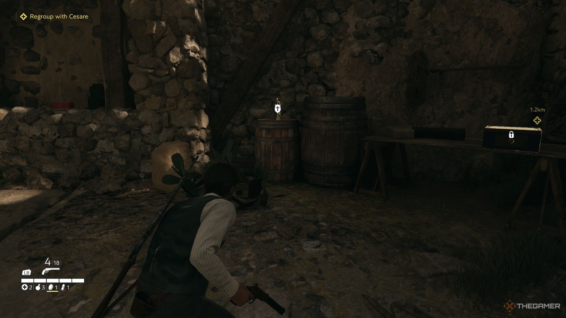 A charm sitting on a barrel, next to a stone wall in Mafia The Old Country.