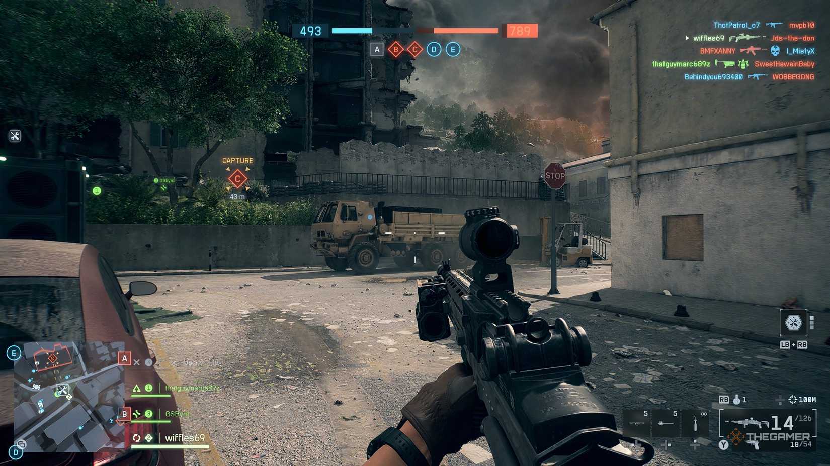 The player in a match in Battlefield 6 holding a DMR that has the Rangefinder equipped. 