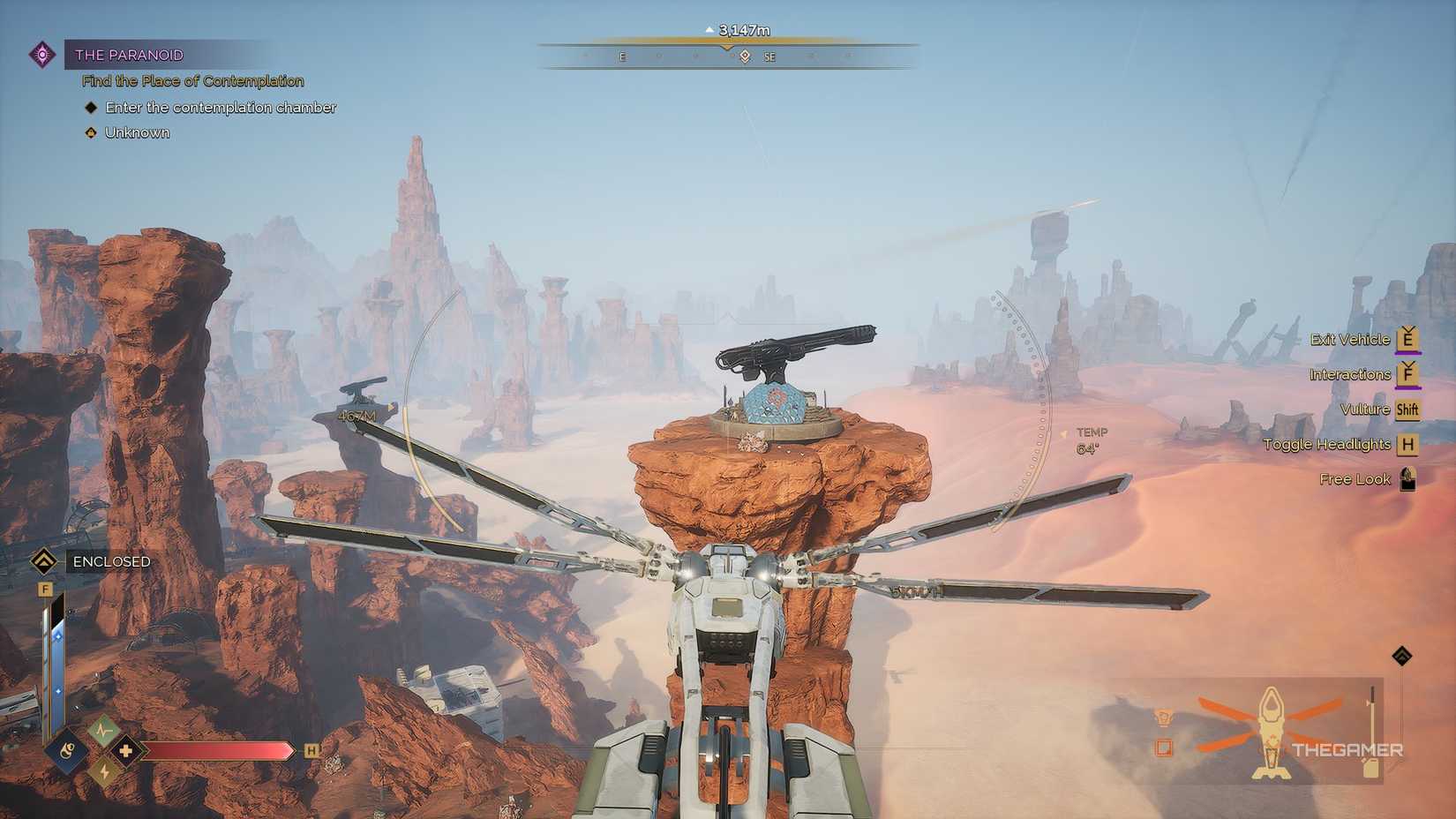The player in their Ornithopther looking at a rocket encampment in Dune: Awakening. 